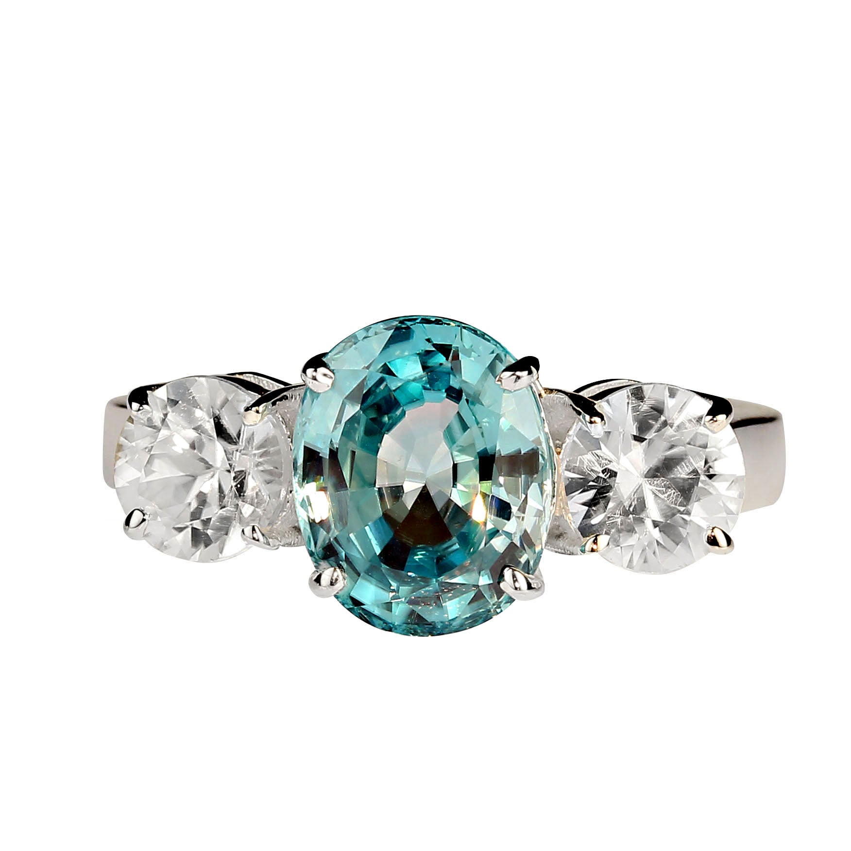 Gorgeous sizzling oval blue zircon, 4.25ct with round side stones, 2.9ct.  All set in glowing sterling silver.  Wear this sparkler all day and evening.  No changes by seller. Sizable 8. Your local jeweler can make changes for you.  MR2339.