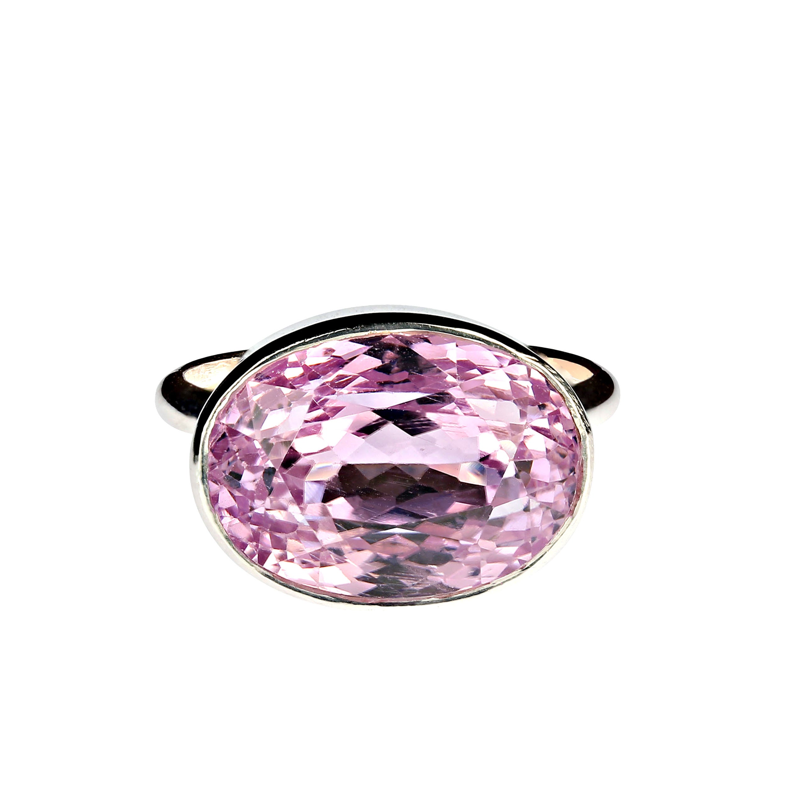 Elegant glowing sterling silver bezel setting create the perfect presentation for the precious pink 15.50ct kunzite. The east-west setting is just one more aspect of the unique ring that makes it a 'must have' in your jewelry wardrobe. No changes by