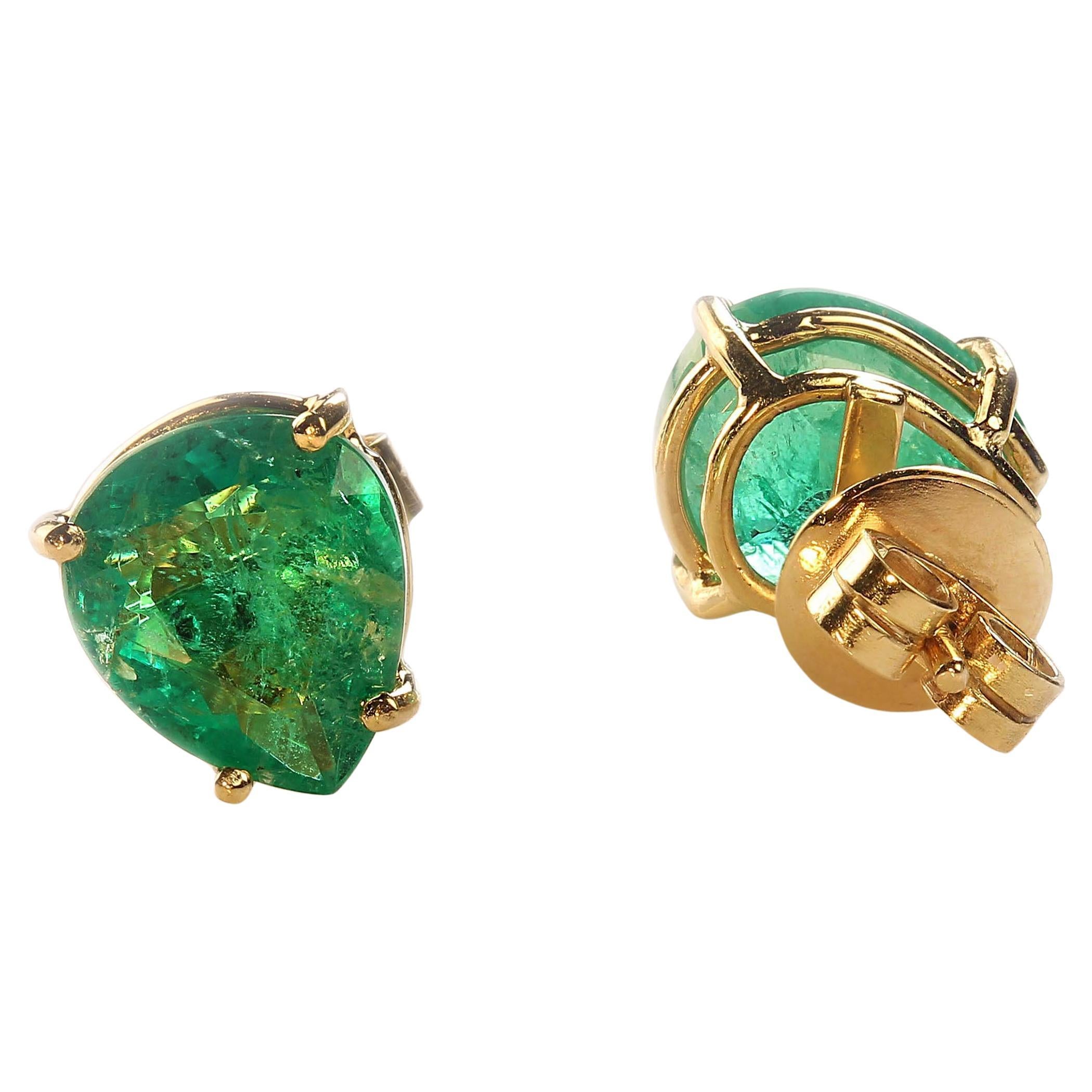 Discover the elegance of these stunning 4.26ctw pear-shaped Brazilian Emerald stud earrings. These wide-bodied, vibrant emeralds, measuring approximately 10 x 8mm each, are set in luxurious 18K rich yellow gold, creating a timeless and sophisticated