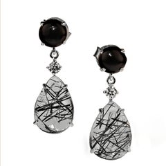 AJD Boucles d
oreilles sophistiquées noires et blanches