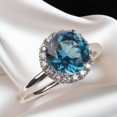 AJD Anello unico e delizioso con topazio blu e diamanti in oro bianco 14K
