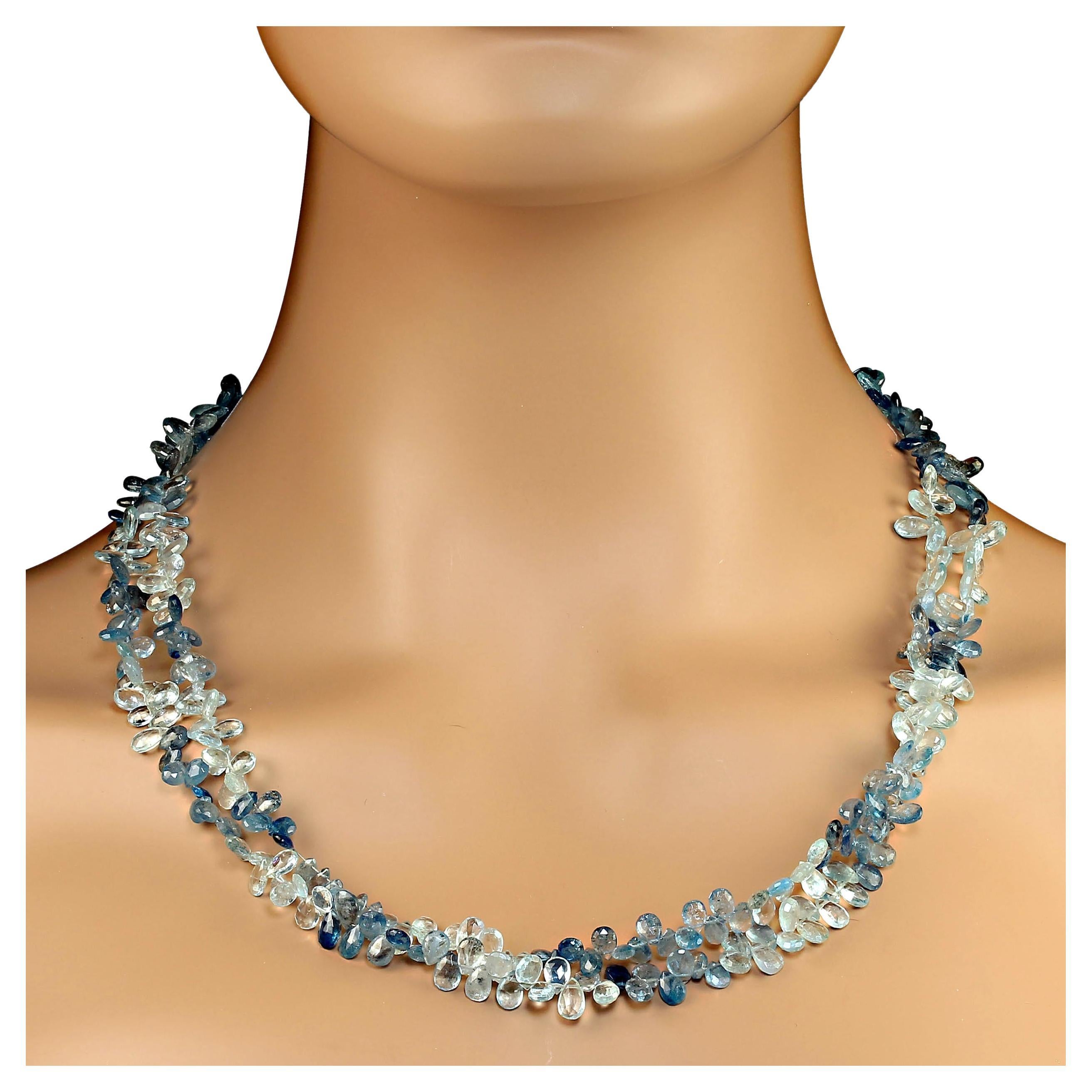 46 Inches of 7MM faceted sparkling briolettes of multi tone aquamarine.  The versatile necklace wraps and ties and twists as your heart desires. This magical long line of multi tone aquamarines  is secured with a double heart silver tone clasp that