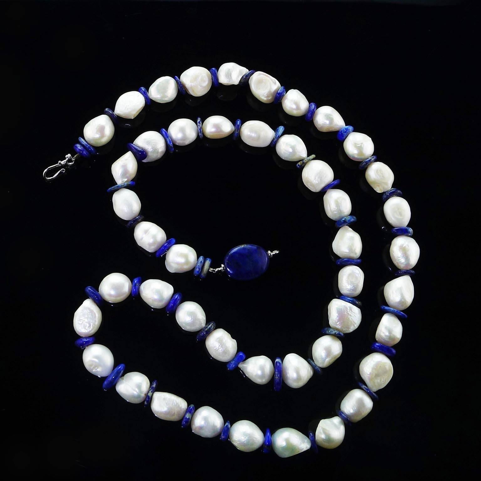 'Pearls are always appropriate'  Jackie Kennedy

This is a very versatile custom made, Large, White Freshwater Ripple Pearl (10-13mm) Necklace spaced with Lapis Lazuli discs. The complementary Lapis Lazuli Clasp can be adjusted to be a focal. Wrap