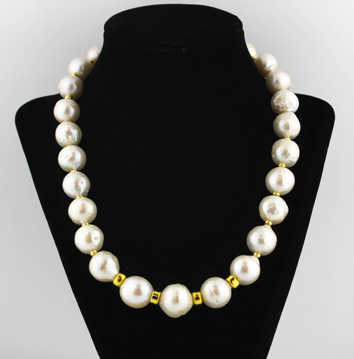 Slightly graduated extraordinary unique cultured South Sea Pearls with very light gold tone accents make up this handmade necklace.
Size: largest 18mm;  Length:  19 inches;  Clasp:  gold tone.  More from this seller by putting gemjunky into 1stdibs