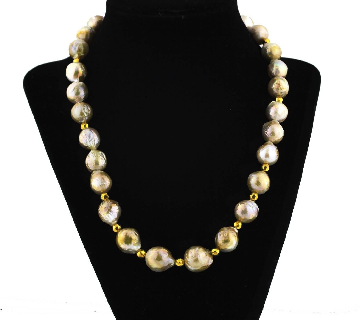 These unique South Sea golden wrinkle cultured real natural Pearls have gold tone accents on this handmade necklace.  
Size:  vary up to approximately 13 mm;  
Length:  19 inches;  
Clasp:  Pearl.



