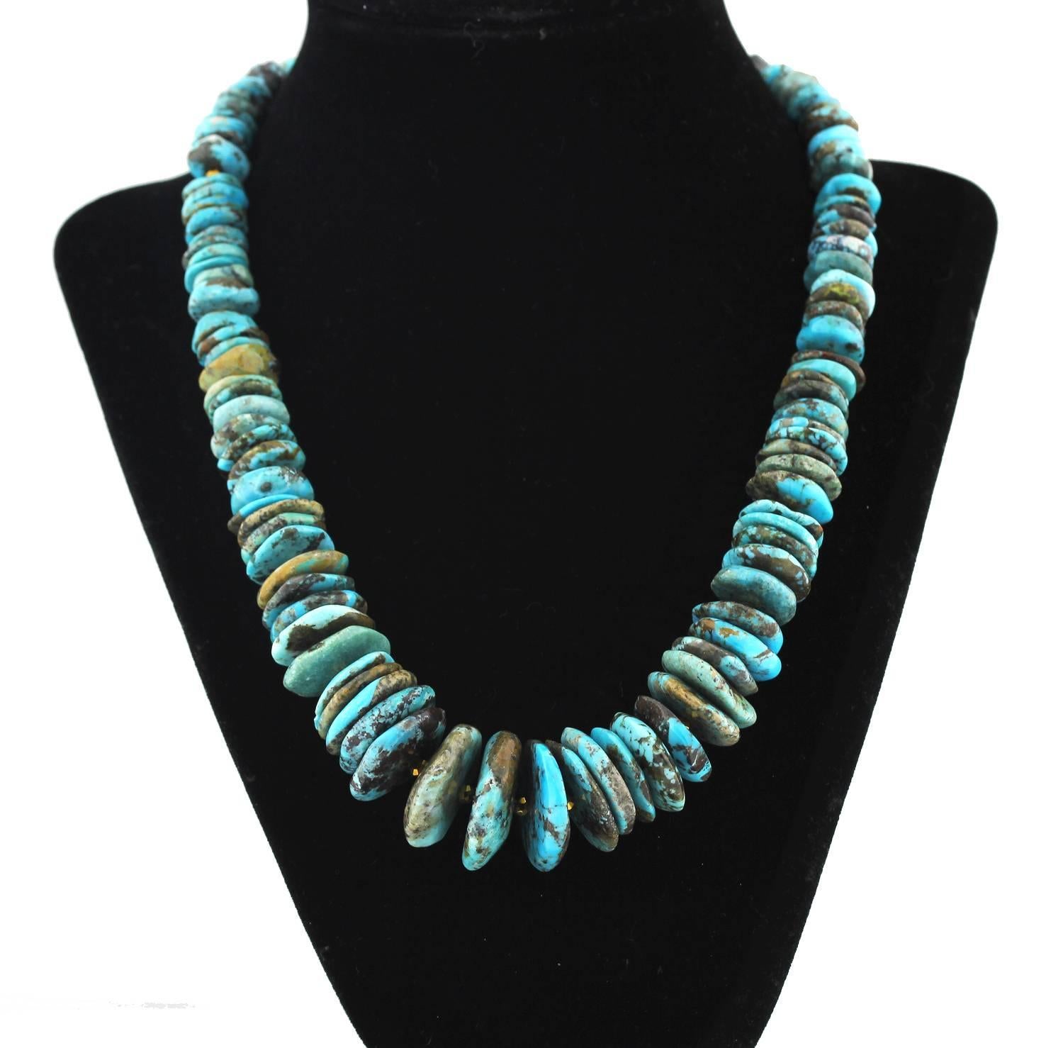 Graduated  unique chunky rondel slices of natural multi-color Turquoise with occasional interspersed gold tone accents make up this handmade necklace.
Size:  11 mm up to 25 mm
Length:  19.5 inches
Clasp:  gold tone