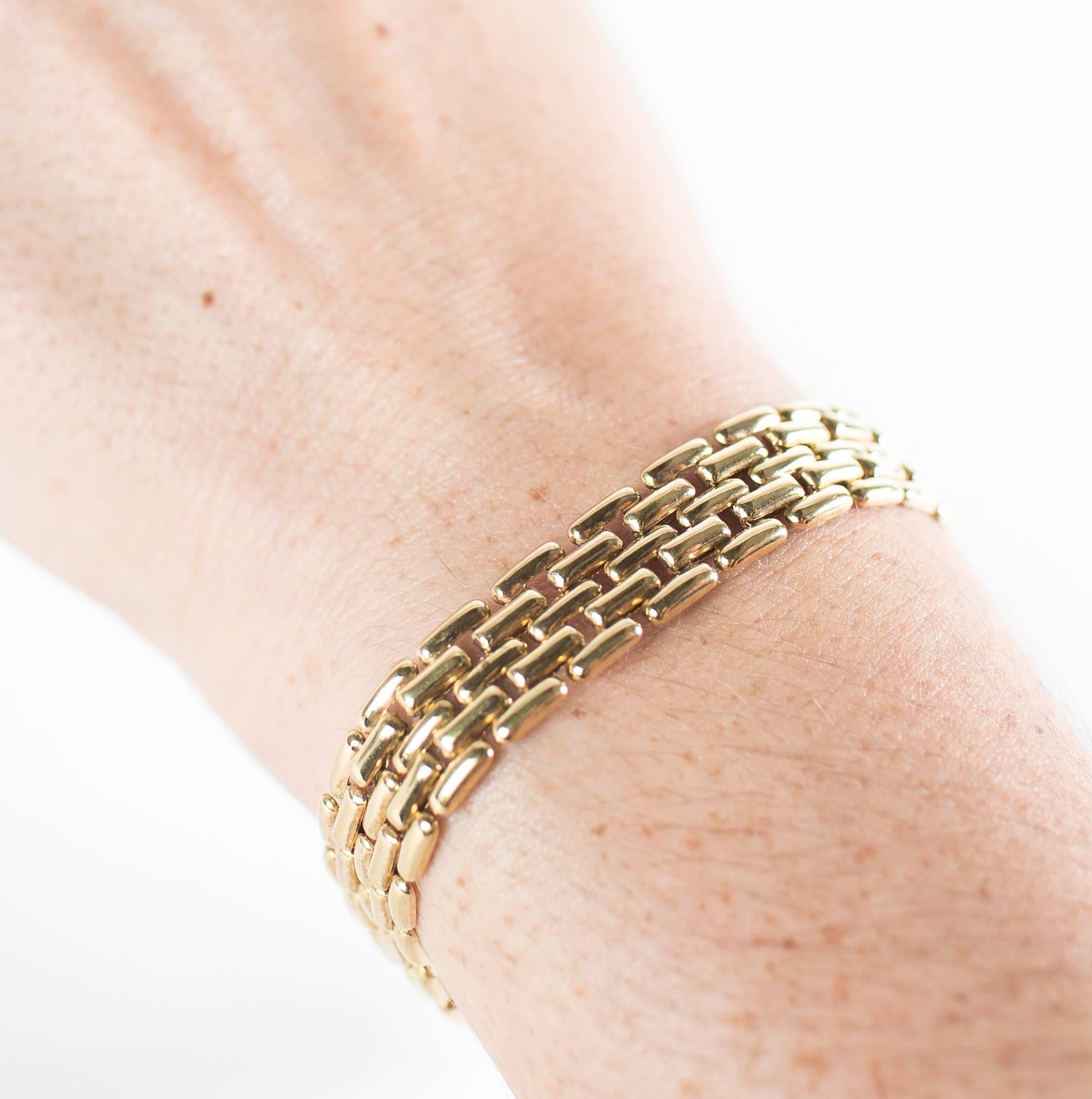 Yellow Gold Bracelet in braided pattern.  It's a lovely delicate braided pattern that is 7/16 wide, the bracelet is 7 inches long.  It has a box clasp and then a s safely lock to keep it securely on your wrist.  This Glowing 14Kt yellow gold