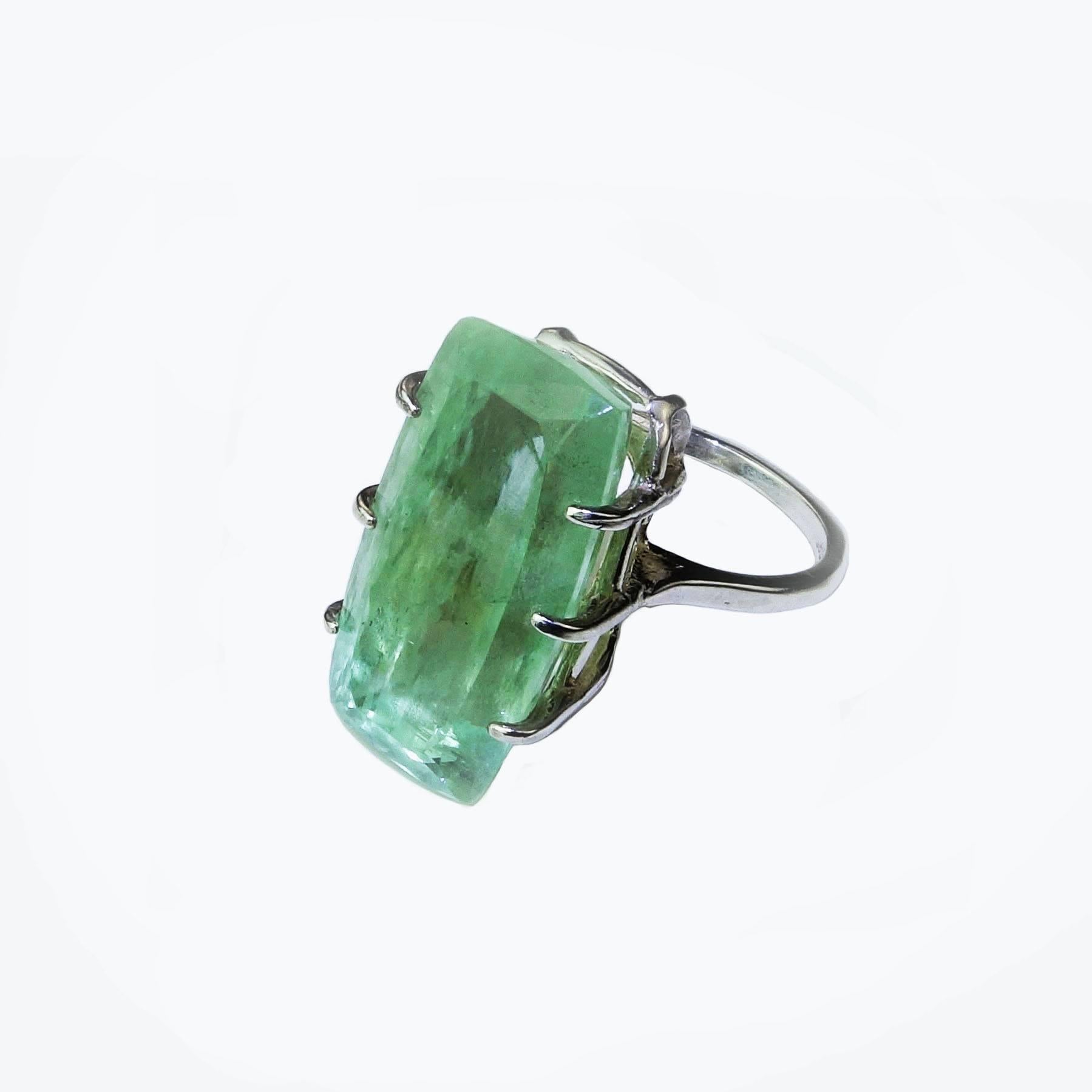 Custom made cocktail ring in Sterling Silver cradling large (25x14mm) rectangular Green Beryl. This lovely Green Beryl sits fairly high on the finger as a Statement ring should. The color is soft and warm, just as you wish a Green Beryl to be. This