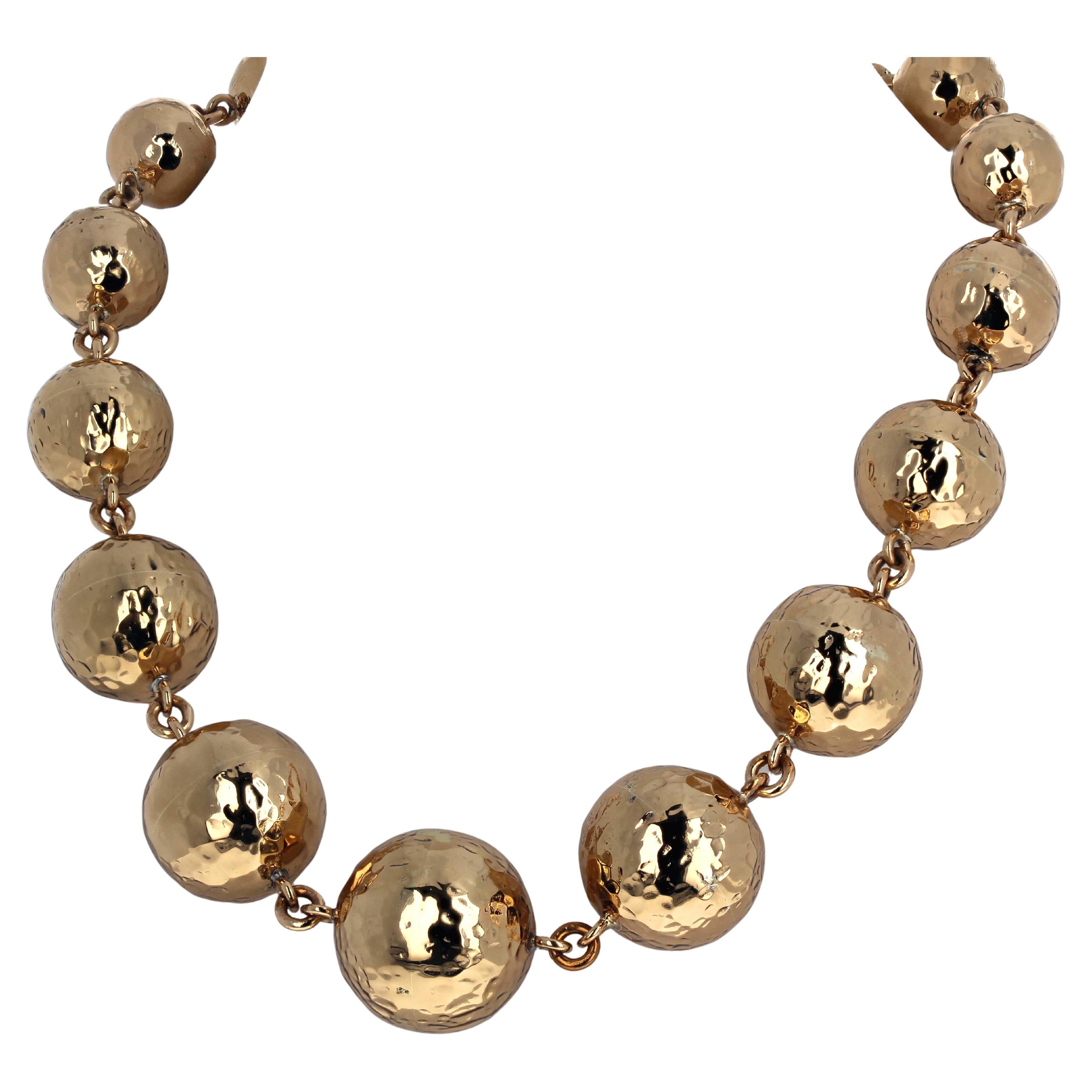 Absolutely fascinating Statement yellow gold plated rondel necklace.  The largest center rondel is 28mm.  The clasp is an easy to use hook clasp with extra loops on it so that you can set it around your neck in lengths from 18 inches to 20 inches. 