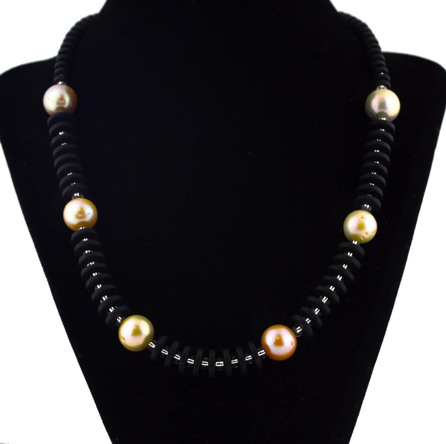 
The sophistication of these unique natural magnificent peachy and light peachy real Pearls enhancing these flat black Onyx rondels with sparkling silver tone crystal accents is super elegant on this handmade necklace.  Size:  approximately 13 mm; 