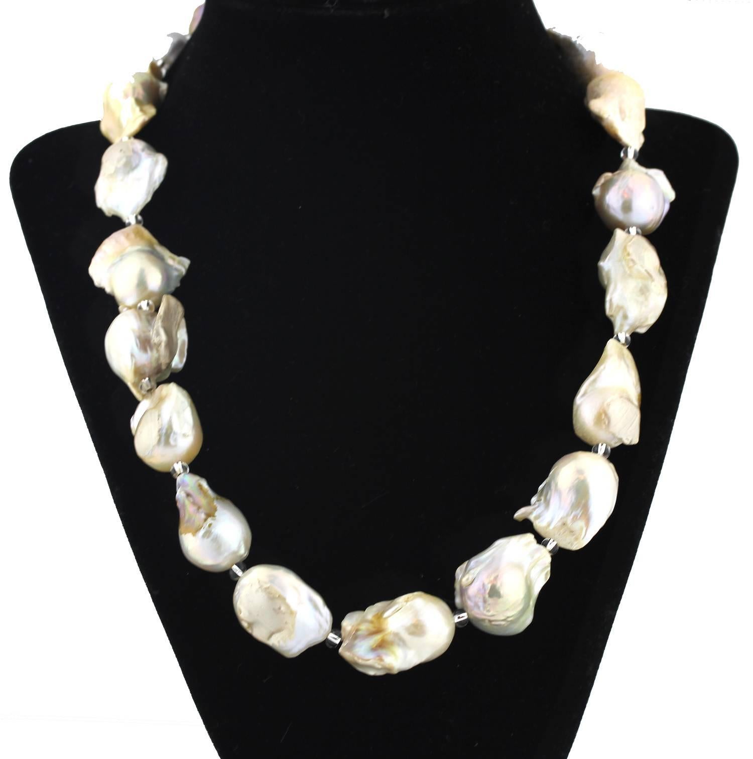 These goldy tone unique Baroque Pearls are the natural color of the nacre from the shell that created them on this handmade necklace.  
Size:  approximately 17 mm;  Length:  20 inches;  Clasp: diamonds set in sterling silver.  
