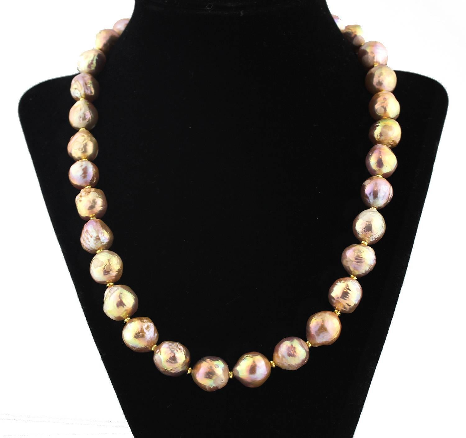 These unique raw natural pink champagne tone imperfect Pearls ( I call them wrinkle nacred Pearls ) are enhanced with gold plated accents on this handmade necklace.  Size:  slightly graduated up to 13.5 mm;  Length:  19.5 inches;  Clasp:  pearl. 