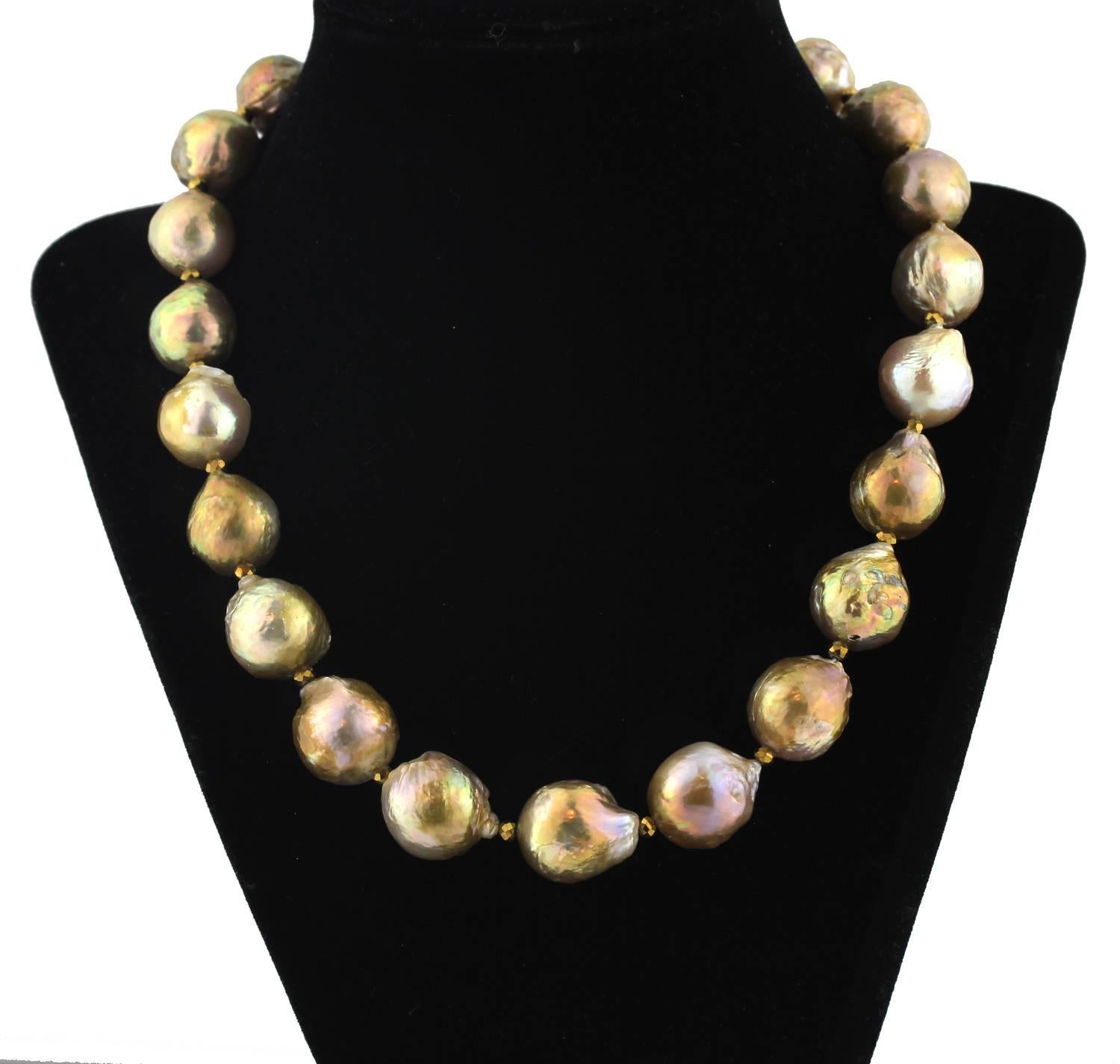 These unique imperfect natural wrinkle Pearls glow mostly brilliant golden with some slight pinky/red tones in different lights on this handmade necklace.  Size:  graduated up to 16 mm;  Length:  18.5 inches
Clasp:  gold plated.  