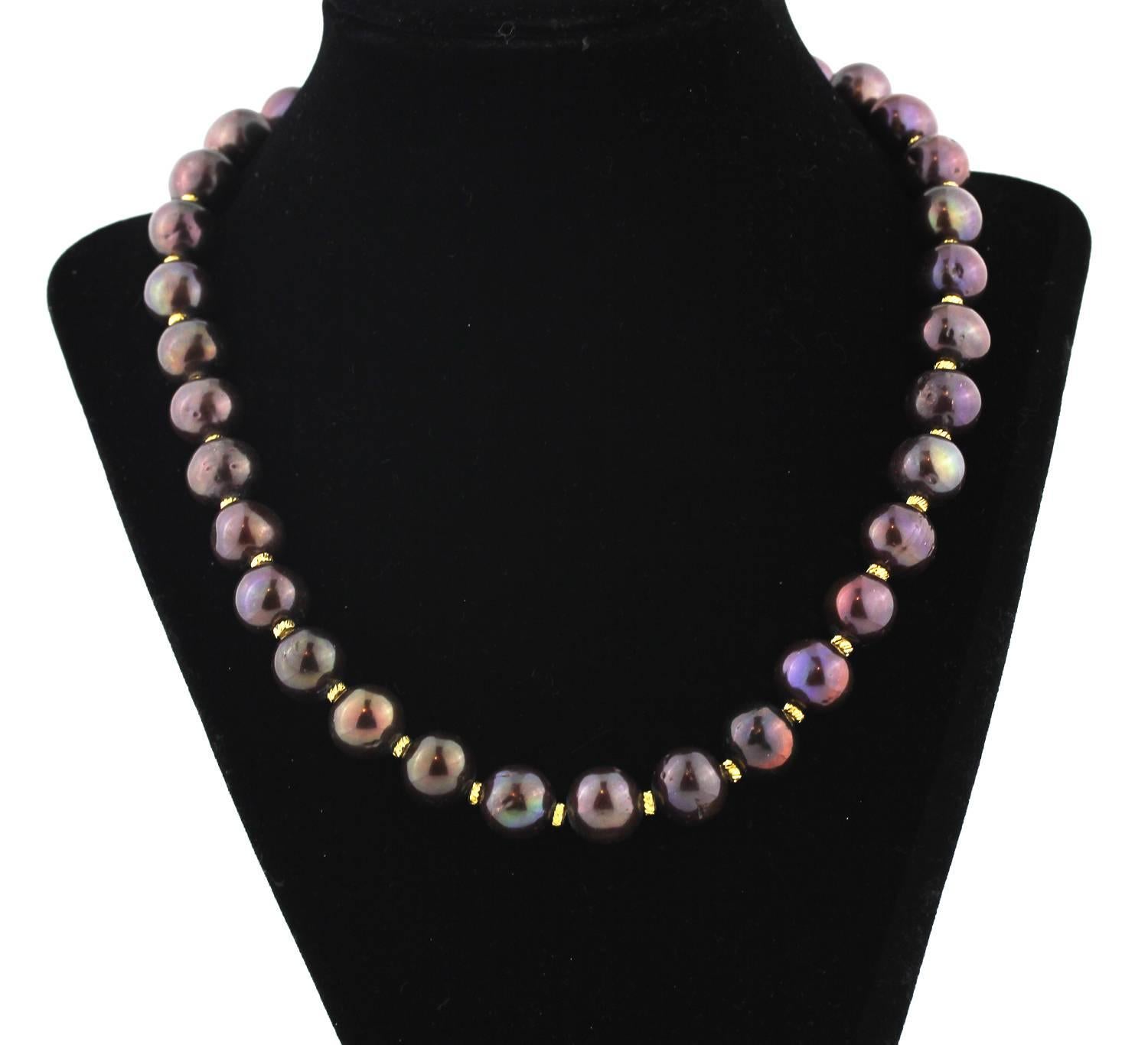 These unique real cultured Pearls glow chocolate and wine colors and are enhanced with goldy accents on this handmade necklace.
Size:  approximately 13 mm;  Length:  19 inches;  Clasp:  gold plated
