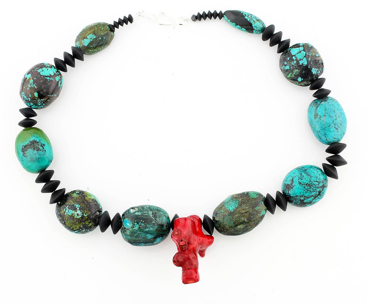 This splendid Turquoise comes from a new mine to the west of Hubei in China.  The mixture of colors on the stones is like artwork.  It is enhanced with black Onyx and a red Bamboo Coral pendant drop in this unique handmade necklace..
Size: 