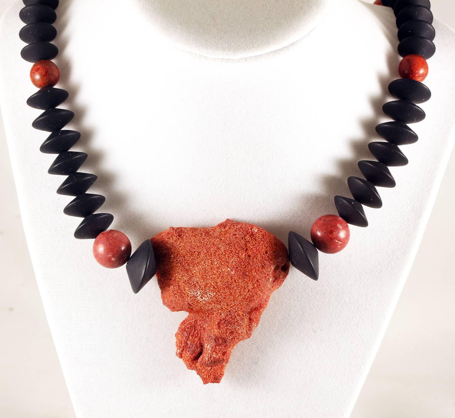 This is a natural piece of orangy/reddish Bamboo Coral enhanced with round polished orangy/reddish Coral and Black Onyx Rondels.
Size:  Pendant piece is 51 mm x 58 mm;  Length:  21.5 inches;  Clasp:  gold tone.  
If you wish faster delivery on your