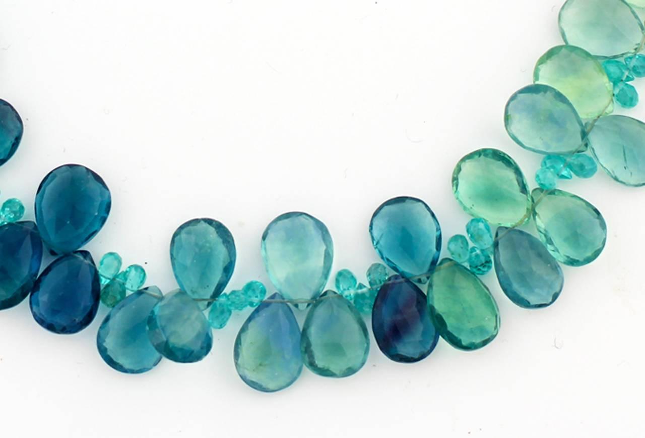 The dramatic beauty of the gem cut sparkling natural Fluorite is enhanced with gem cut natural blue Brasilian Apatite and is offset to look more glamorous.
Size:  large 
