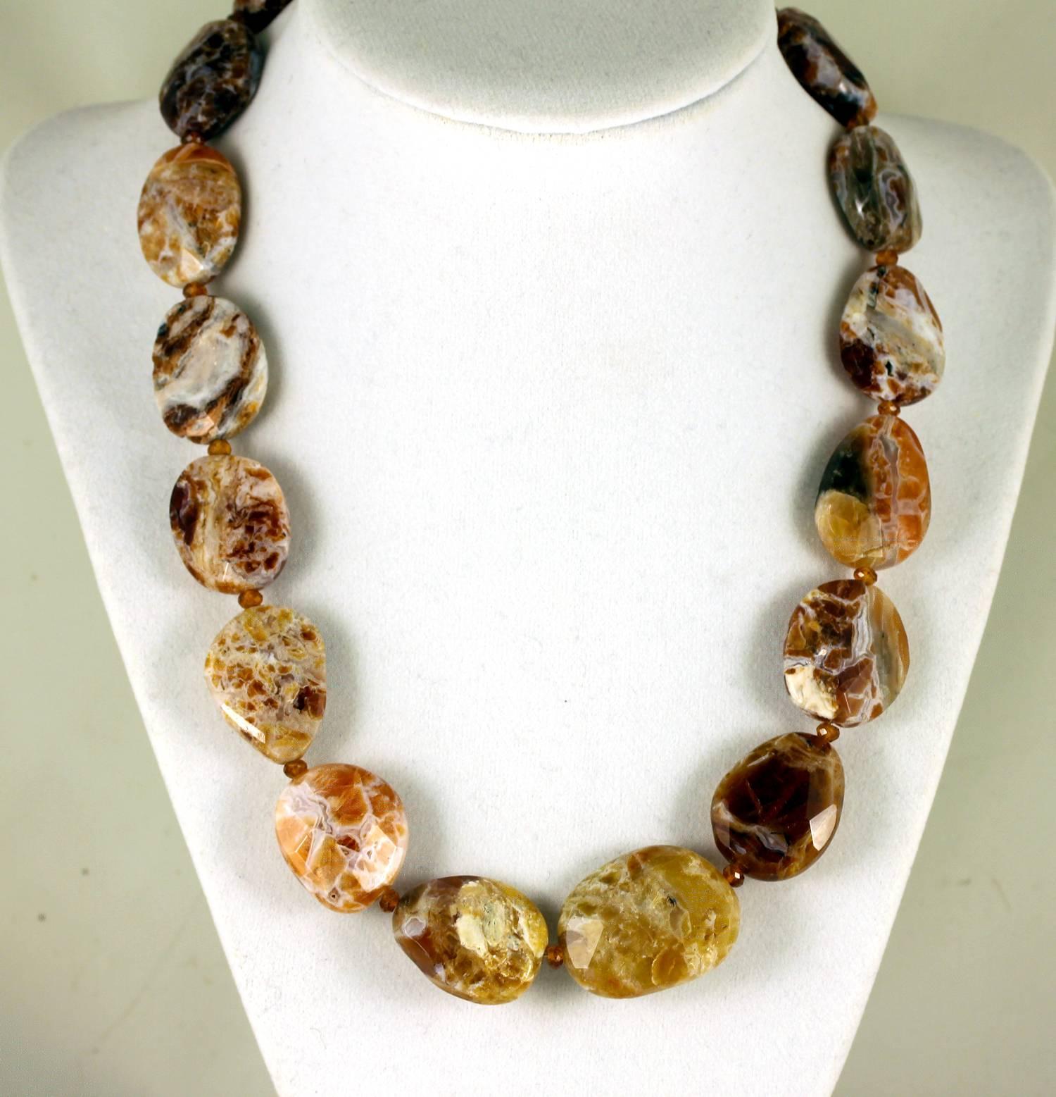 This rare unique handmade Opal necklace is so varied in colors it is called Brandy Opal. It is partially translucent and is accented with sparkling gem cut Hessonite Garnets which enhance the differences in the colors,  Size: approximately 20 mm x