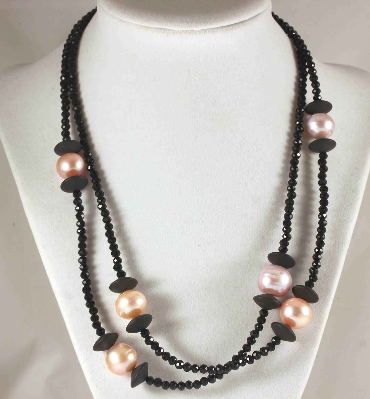 Unique Handmade Double strand of sparkly black Spinel enhanced with different colored glowing cultured South Sea Pearls necklace
Size:  Pearls approximately 13.5 mm; Length:  19.5 inches
Clasp:  Sterling Silver inlaid with tiny diamonds    