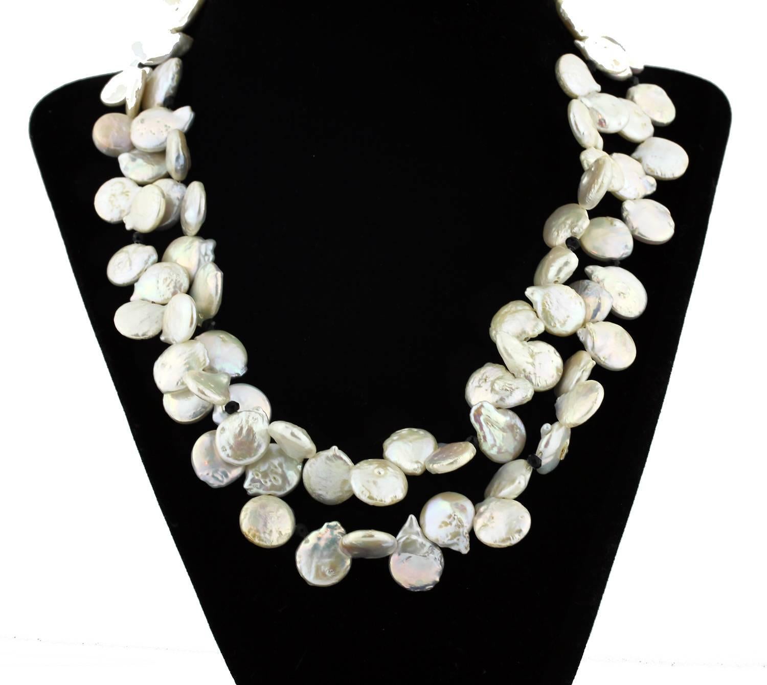 Double strand of "swingy&uquot; beautiful leaves of cultured white Pearls enhanced intermittently with sparkling black Spinel.
Size:  Pearls slightly graduated to approximately 16 mm
Length:  17.75 inches
Clasp:  Diamond encrusted Sterling