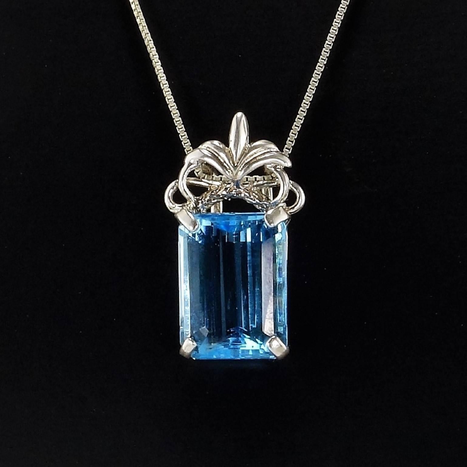 Brilliant Emerald Cut Sky Blue Topaz Set in Ornate Sterling Silver Pendant In Excellent Condition In Raleigh, NC
