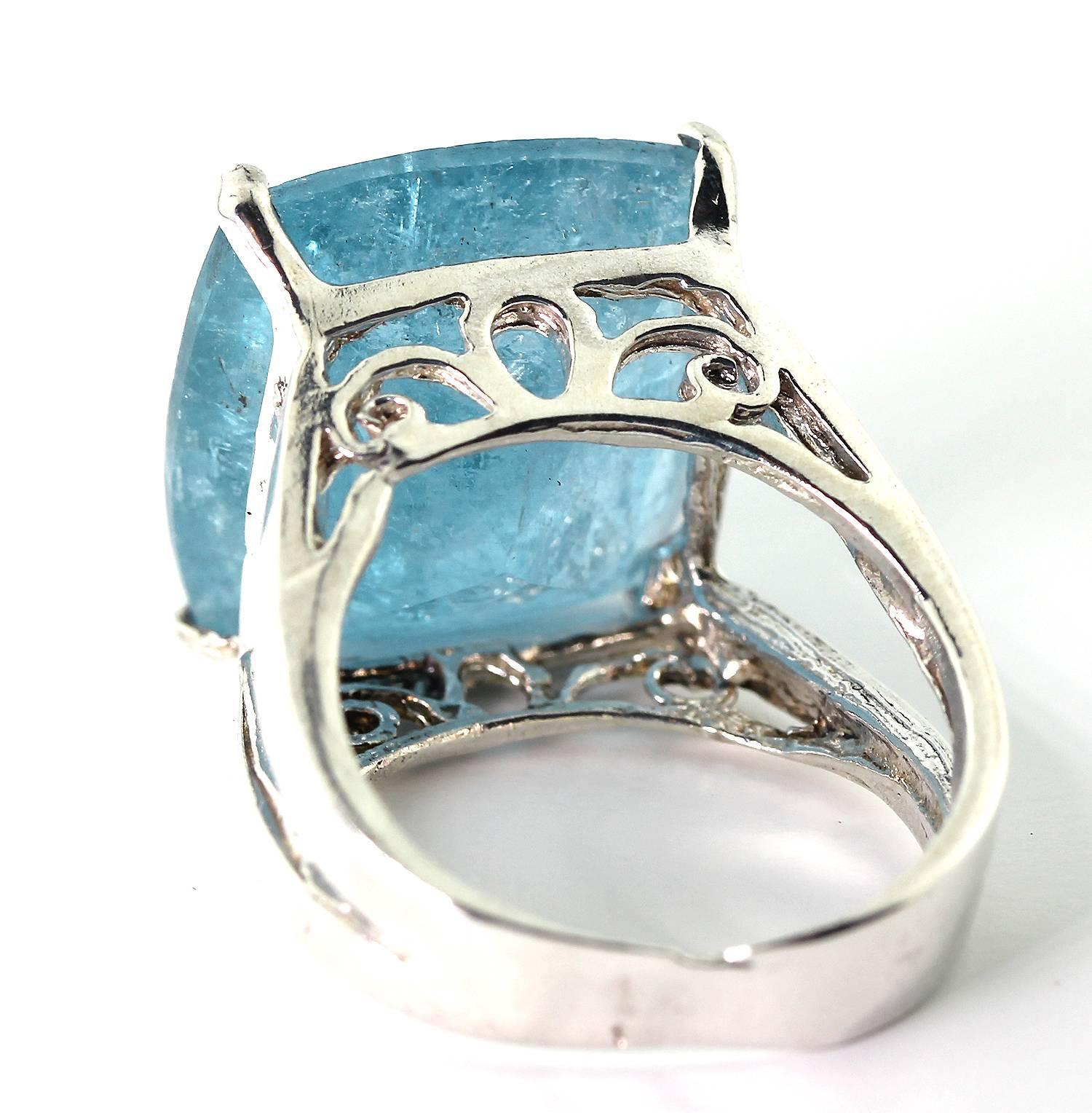 This 14 Carat huge blue glittering Aquamarine does have inclusions but they add charm to the thick delightful blue color of the transparency of the gemstone set in a handmade Sterling Silver.  This is beautifully cut and has no chips or nicks.
Size: