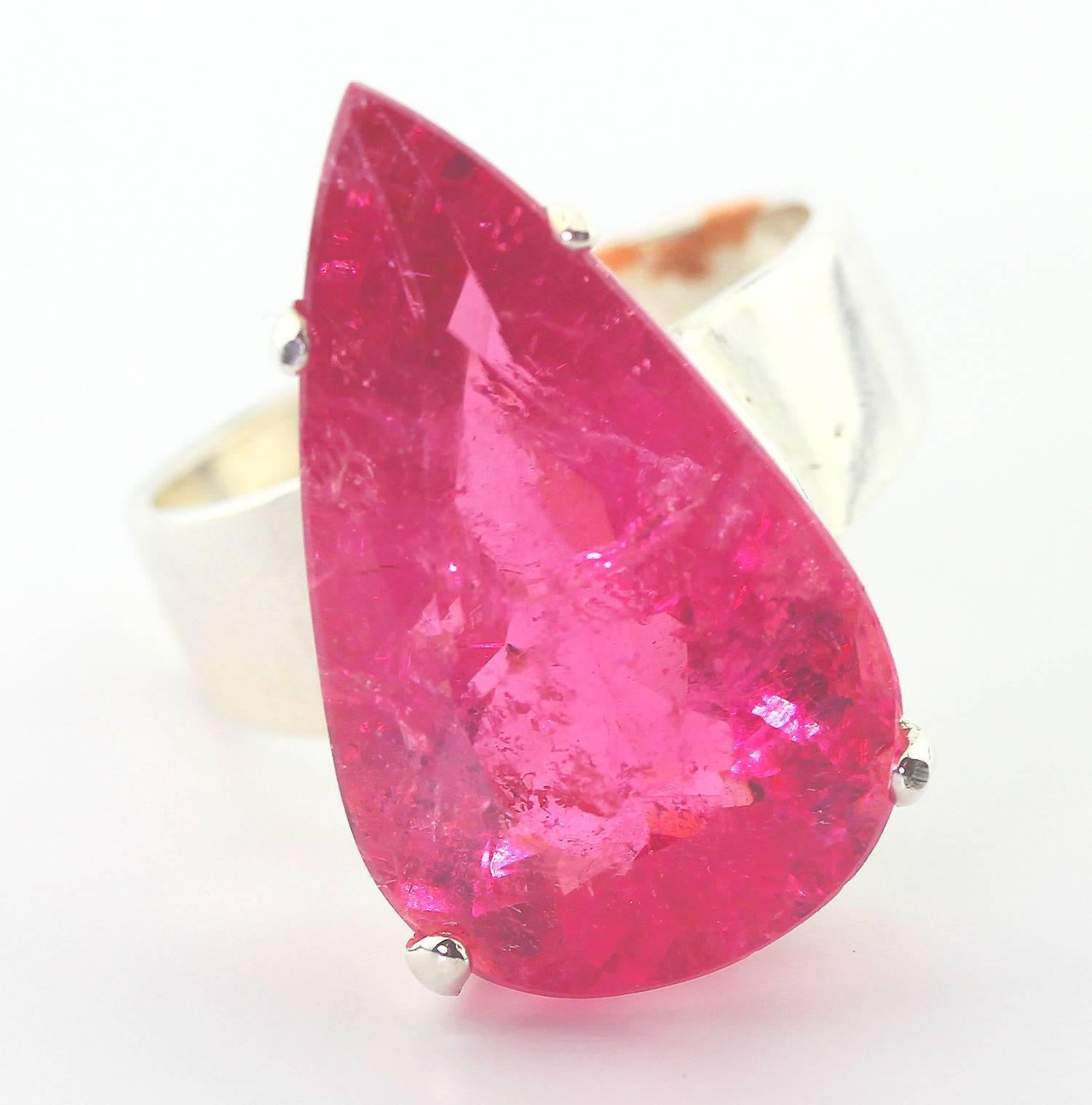 This 15 Carat glittering Bright Pink Tourmaline is extremely rare especially this size.  It has some little inclusions which magically enhance the sparkle of the gemstone ( no nicks and no chips.)
Size:  24 mm x 13.8 mm
Ring:  Handmade in Sterling