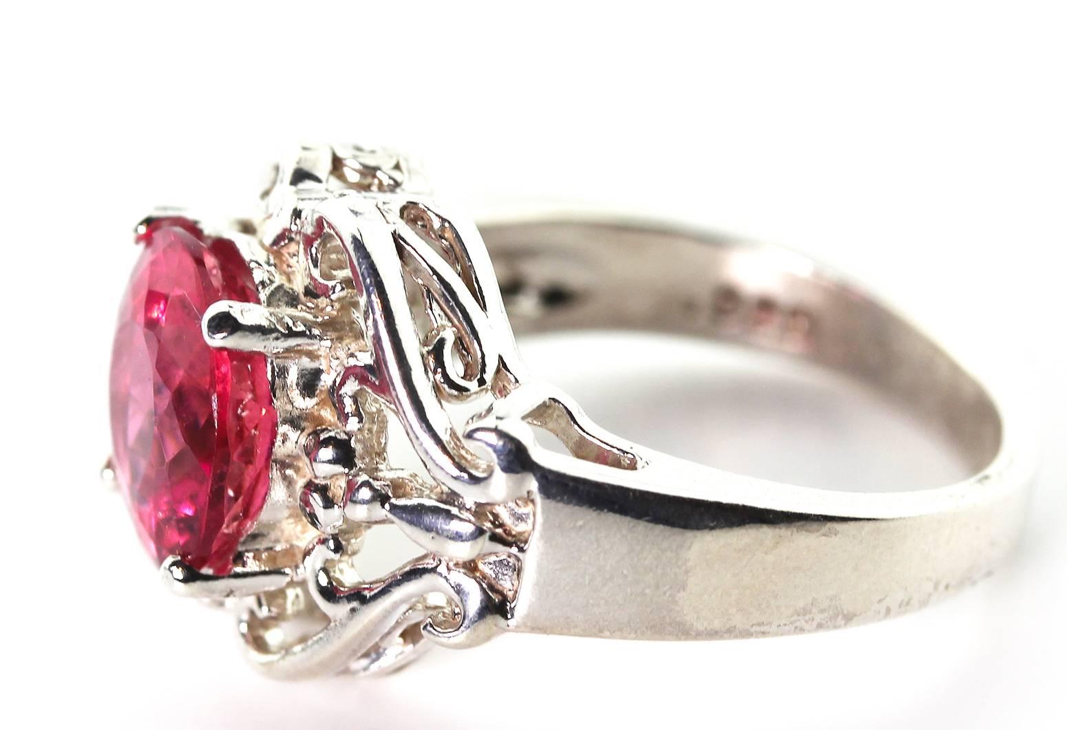 This unique natural glisteningly beautiful 2.74 Carat brilliantly reddypink / pinkyred handmade Tourmaline ring is very rare and stands out like a lighthouse on your finger. Perfect for day into evening events.
Size:  9 mm round
Ring:  Sterling