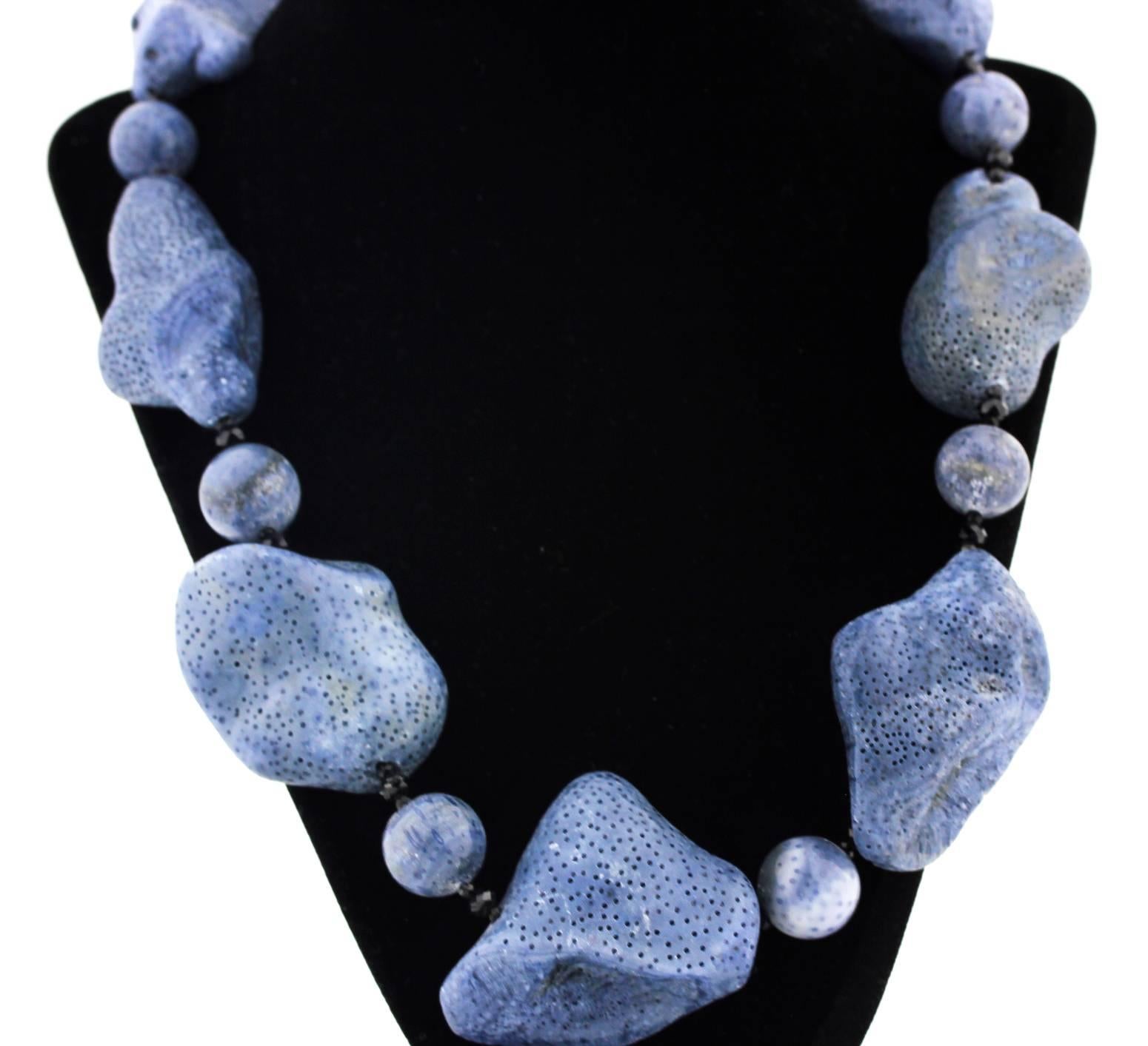 Beautiful blue natural Coral enhanced with sparkling black Spinel
Size:  largest Coral 46 mm x 41 mm
Length:  22.5 inches
Clasp:  Diamonds set in Sterling Silver