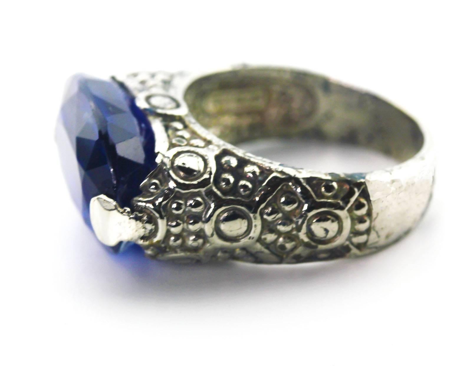 This gorgeous glowing 12.76 Carat oval Nepalese Kyanite (12 mm x 16 mm) is set in an interesting antique Sterling Silver ring.which is a sizable 7.