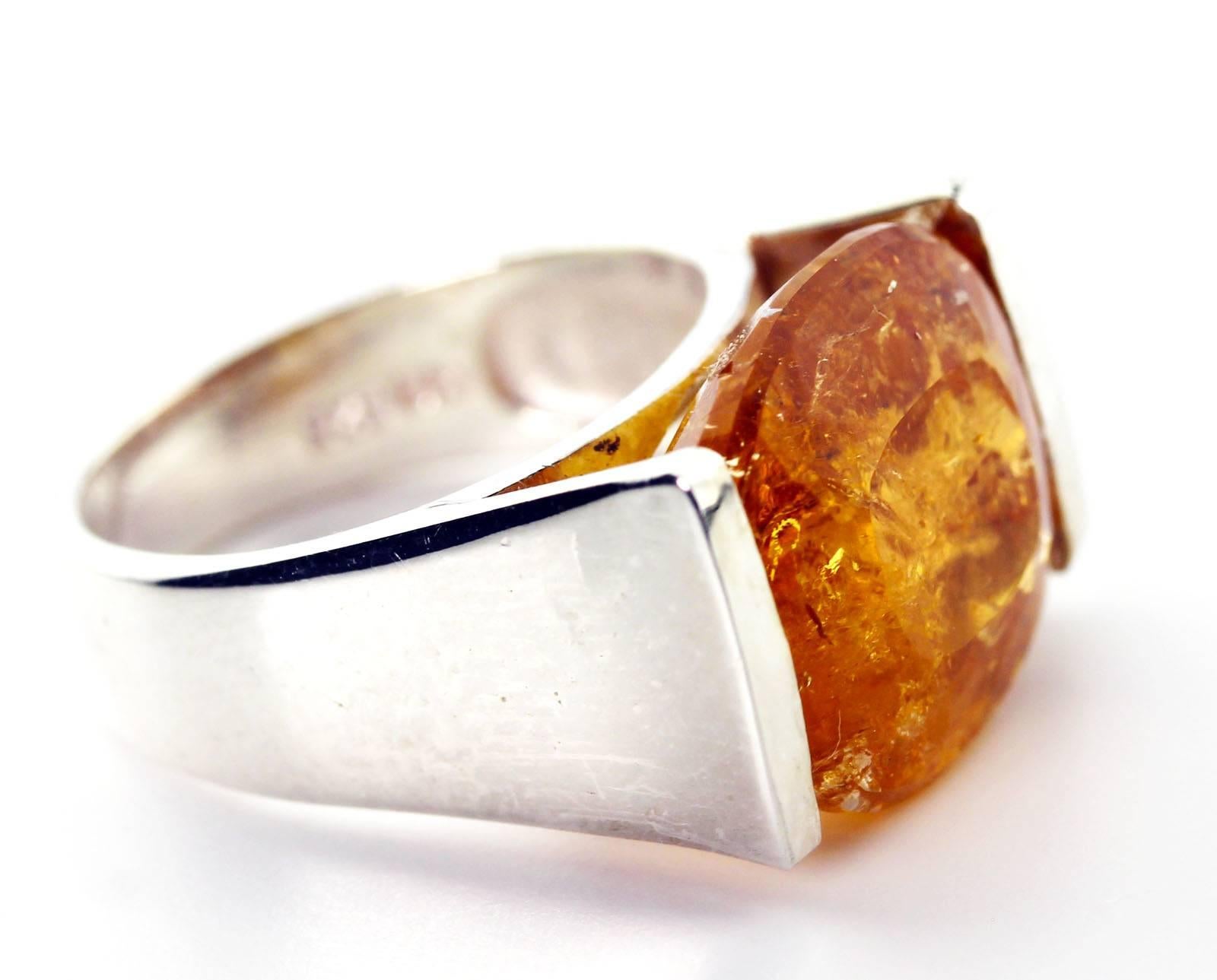 Golden peach 14 Carat glittering natural unique translucent Imperial Topaz from the famous mine in Ouro Preto in Minas Gerais, Brasil.  This highly sparkling gemstone is a roval (14 mm x 14.2 mm) and is set in a handmade Sterling Silver ring size 6
