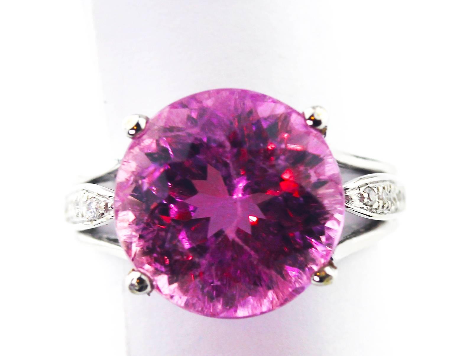 Brilliant natural unheated untreated clear 9 Carat pink Kunzite enhanced with tiny little sparkling diamonds set in a 10K white gold ring.  The unique ring is a size 6 (sizable).  This gemstone is from the mines in Minas Gerais in Brasil.  More from