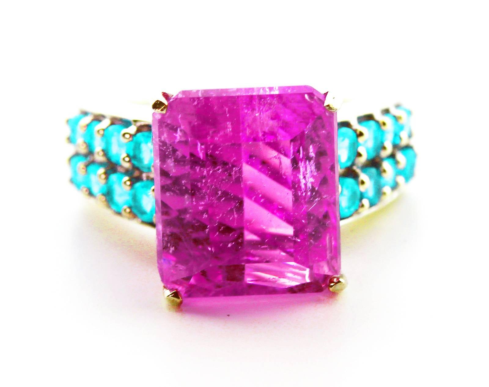 Intense pink transparent translucent sparkling natural unheated untreated 11 Carat Brasilian Kunzite  enhanced with brilliant blue Apatite set in rhodium plated Sterling Silver ring.  The ring is a size 7 sizable.