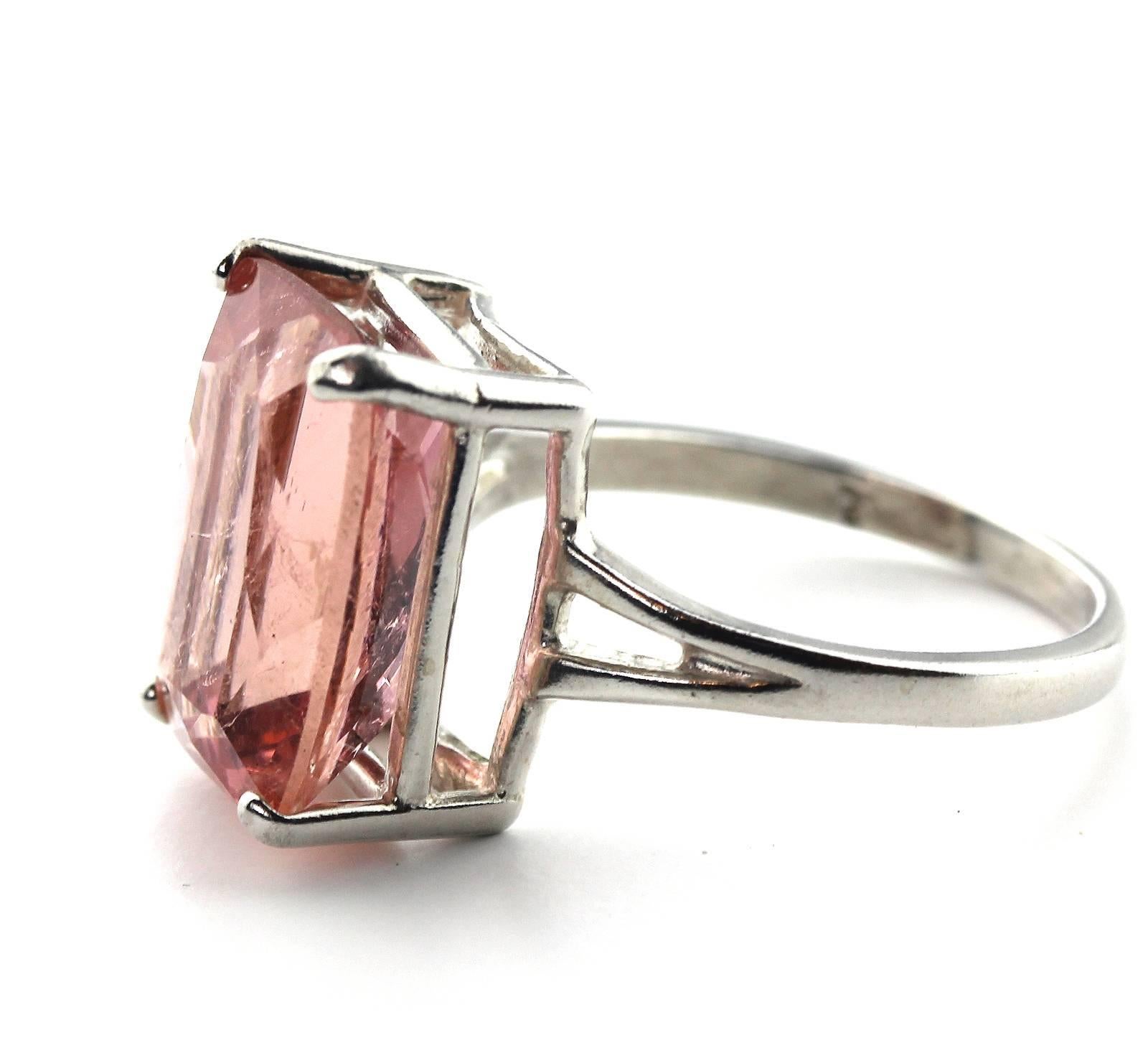 This beautiful 8.12 Carat pink emerald cut Tourmaline sparkles magically and is sent in a unique handmade Sterling Silver ring size 7 (sizable).  The gemstone has no visible inclusions and comes from the famous Minas Gerais Mine in Brasil.  More