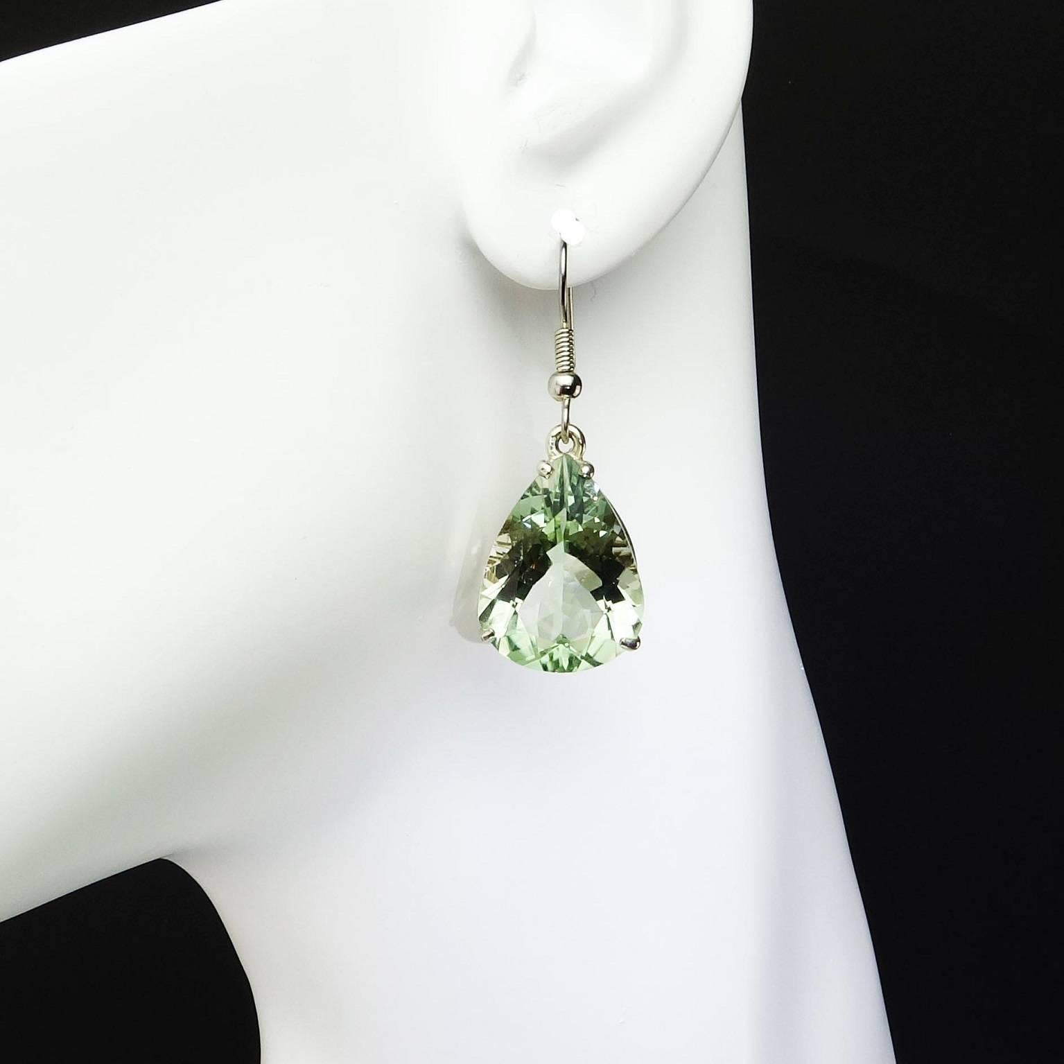 Delightful soft, sparkling green gem cut Prasiolites (green Amethyst Quartz) dangle earrings.
Size: 38 mm long
Sterling Silver French hook and setting.