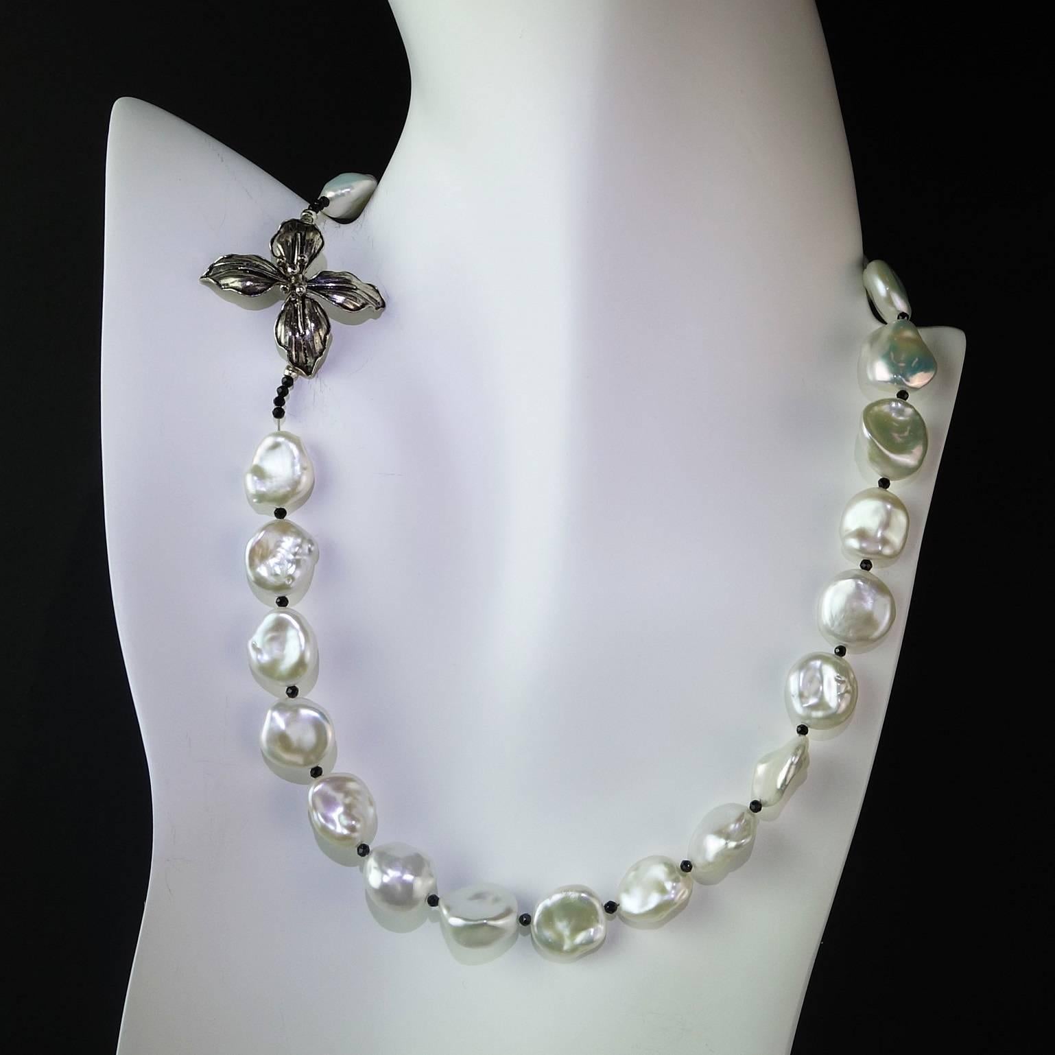 Delicate Choker Necklace of White Iridescent Freshwater Pearls accented with sparkling faceted Black Spinel and finished with a Turkish Sterling Silver Flower Clasp.  This 17 inch necklace is softly glowing and perfect for all occasions. The pearls