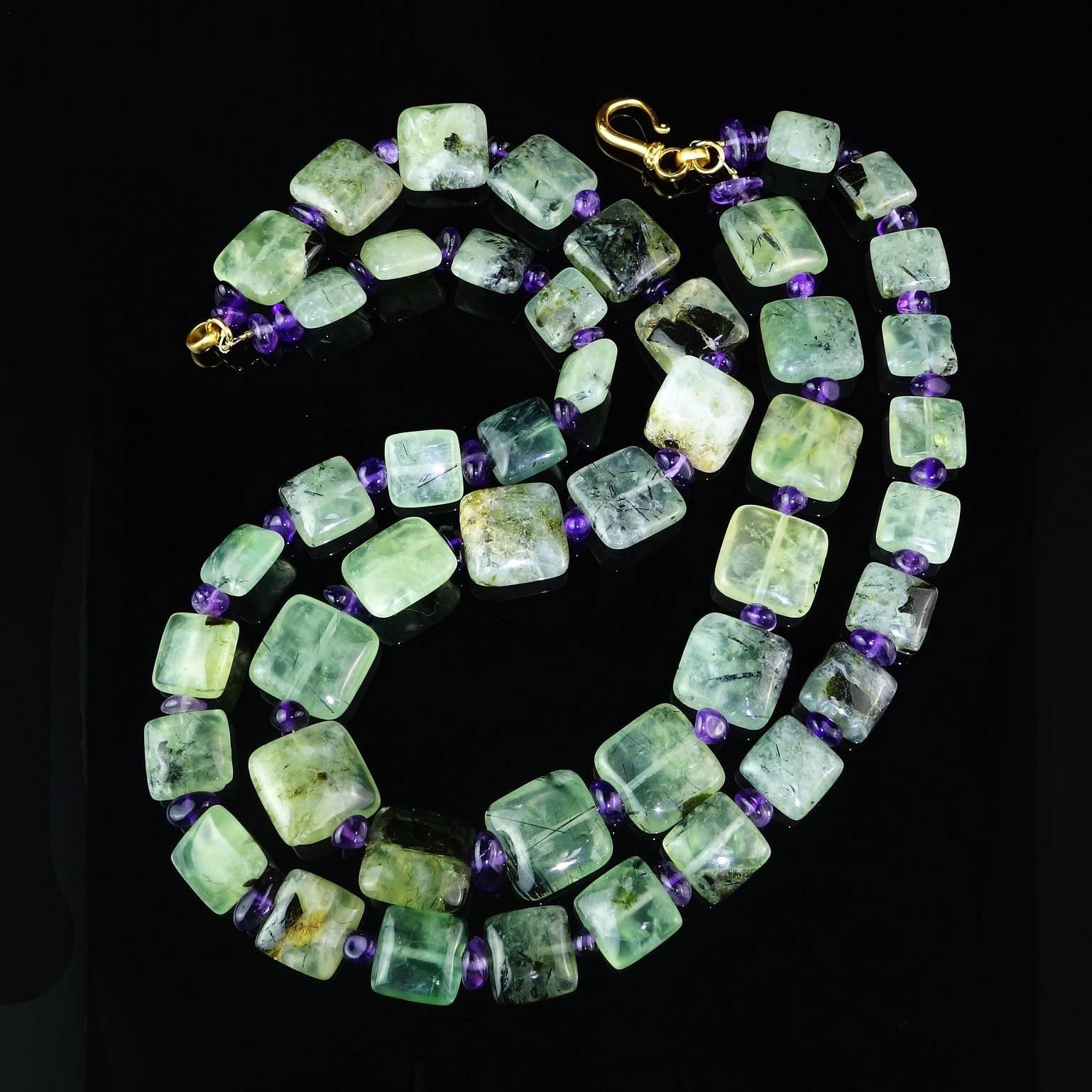 Necklace of two sizes of tablets of highly polished green Brazilian Prehnite enhanced with jewel tone tumbled and polished Amethyst. The Prehnite was hand carried from our favorite supplier in Sao Paulo. The tablets are 20MM and 15MM.  The tumbled