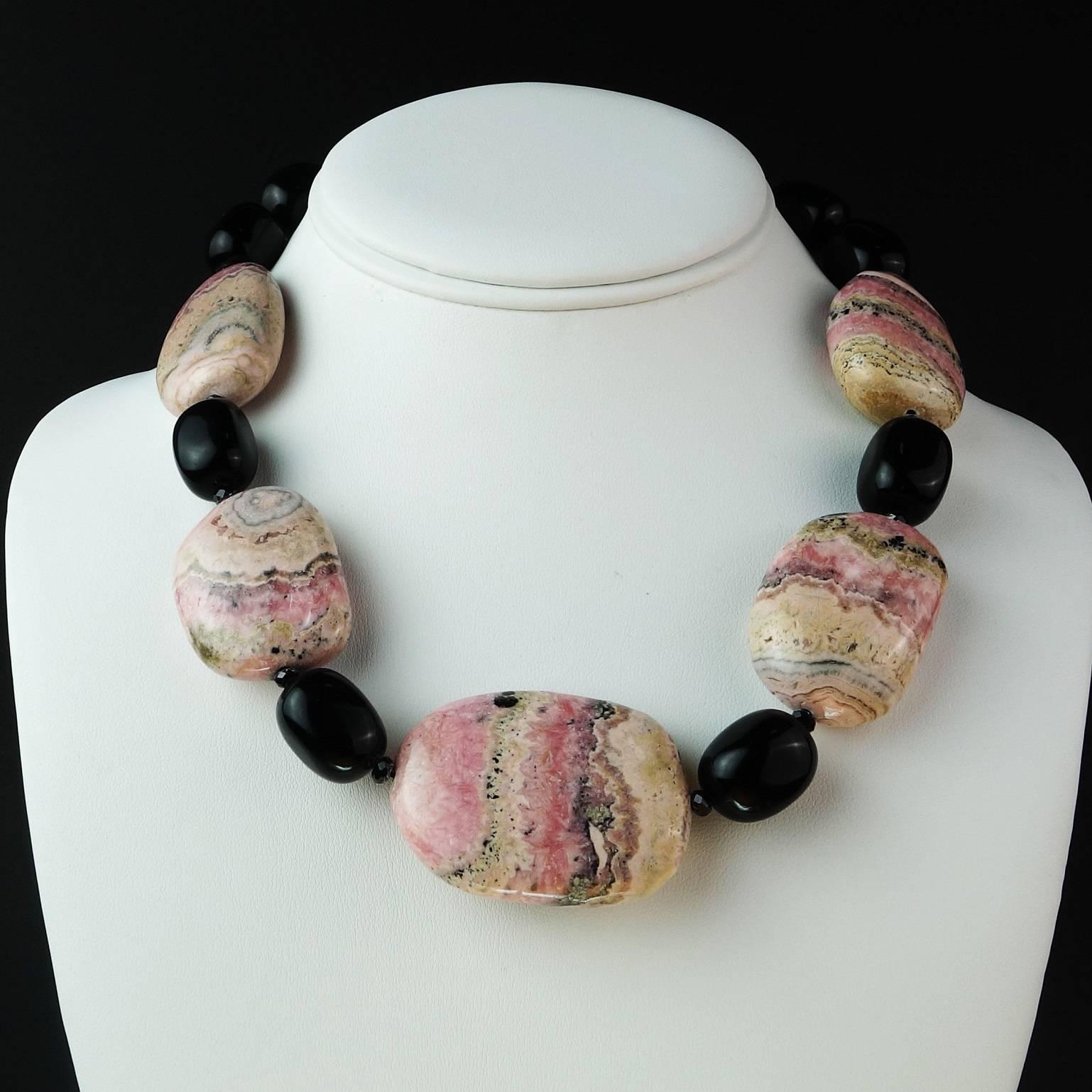 A Gemjunky necklace of five gorgeous tablets of highly polished Argentine Rhodochrosite with lovely matrix and sparkling Black Onyx. The necklace is 18.5 inches in length and if you like Rhodochrosite, this is your necklace! It is secured with a