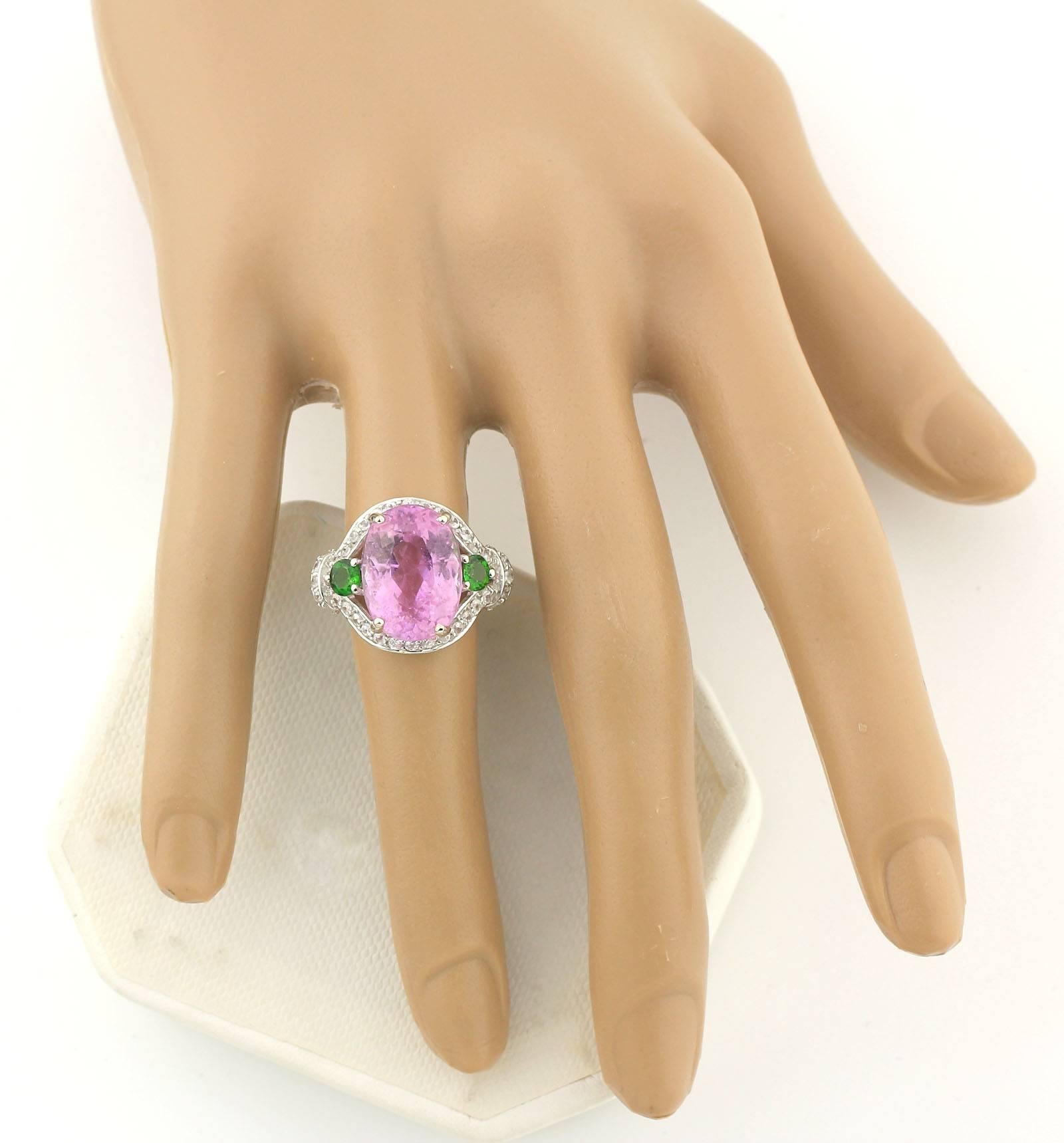 Sparkling brilliant natural 9.25 Carat Pink Kunzite enhanced with sparkly green Chrome Diopside and brilliant natural Zircons set in this unique handmade Sterling Silver ring. The quality and color of this Kunzite is superb.
Size:  15 mm x 11