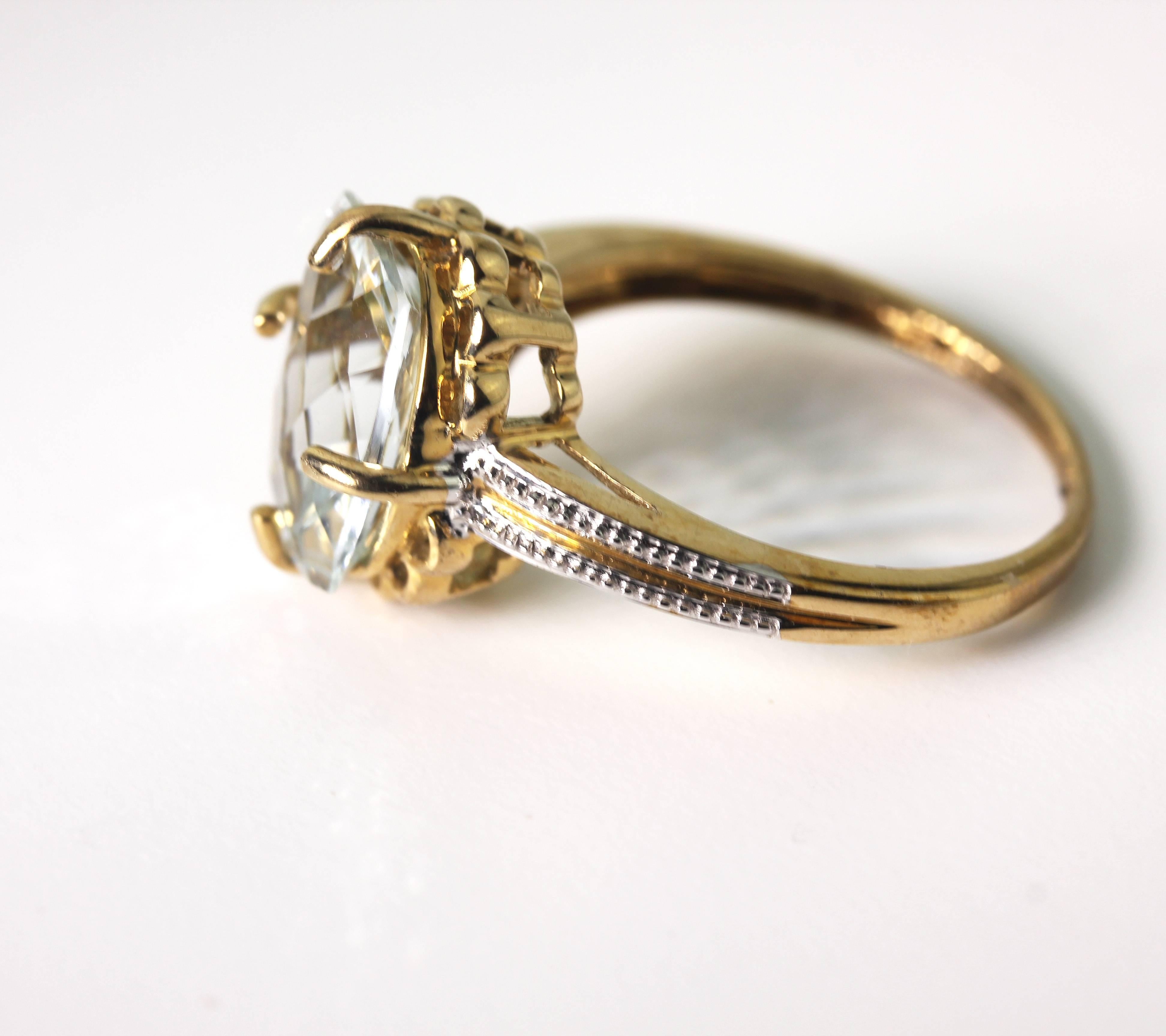 This beautiful sparkling 2.78 Carat eye clean Aquamarine is set in a unique 10 KT yellow gold (enhanced with decorations of white gold) ring size 7. (the ring is sizable)  More from this seller by putting gemjunky into 1stdibs search bar.