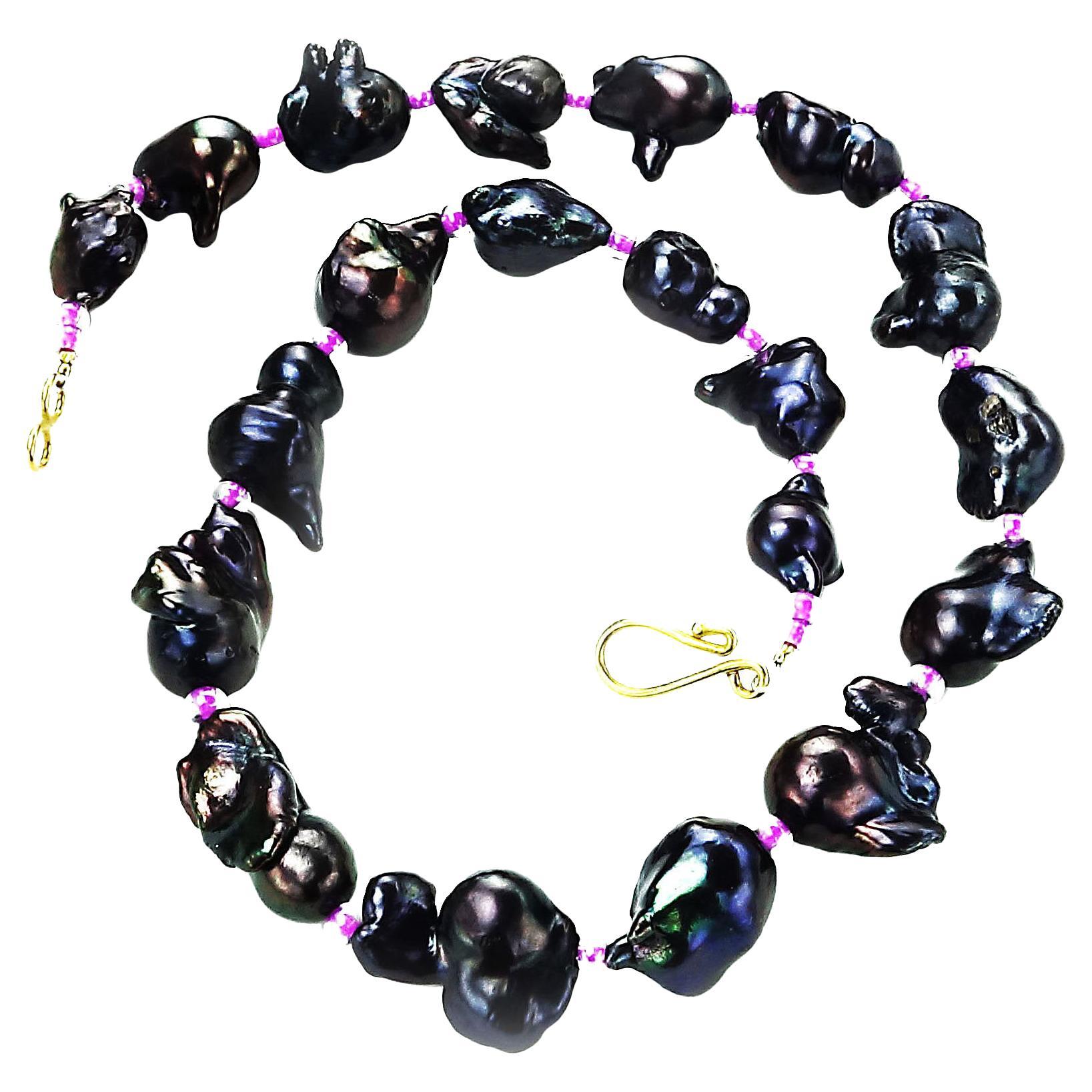 'Put on your Pearls Girls'   Lulu Guinness
Graduated Baroque Pearl necklace in iridescent deep wine red with pink czech bead accents.  These lovely, free form Baroque Pearls are graduated from 15mm to 23mm and secured with a hook of 18K gold