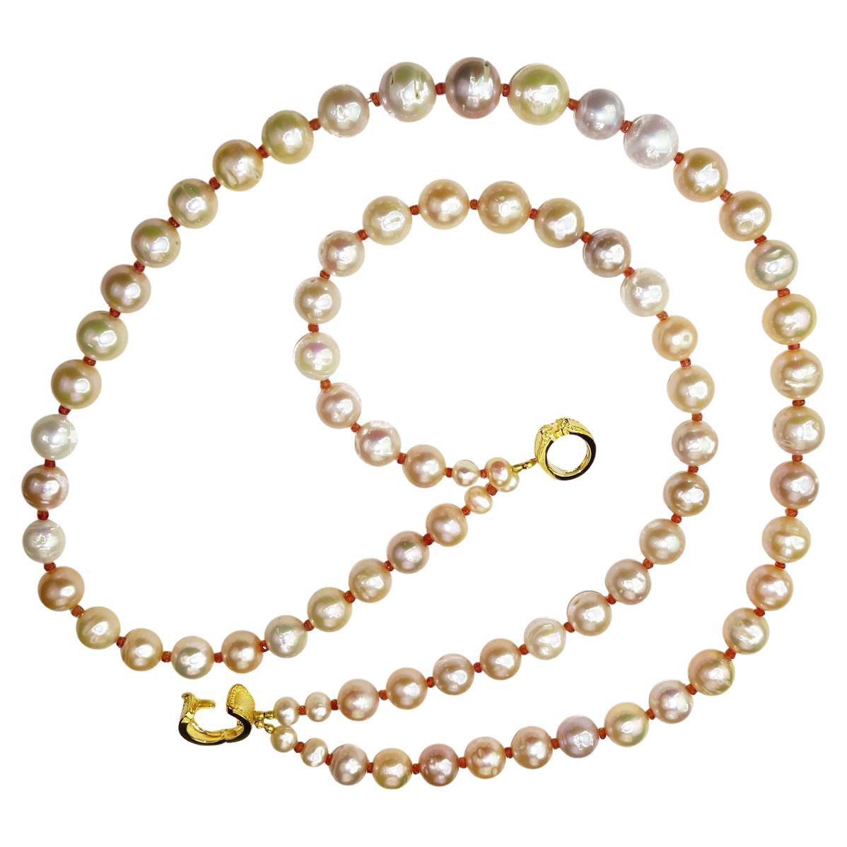 'Nothing gives the luxury of Pearls. Keep them in mind.'  Diana Vreeland

Custom made two strand necklace of Peachy Pink 13-15mm lustrous, iridescent Pearls with a few shades of mauve and cream for accent. These Pearls have a gorgeous luster and