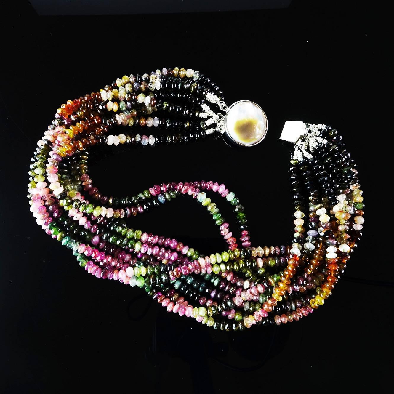 Tourmaline, Tourmaline, Tourmaline in ten strands of multi color rondels custom made necklace. At 16.5 inches this necklace can be worn as is or given a twist or two for a different look. The box clasp is mother of pearl. Tourmaline is the October