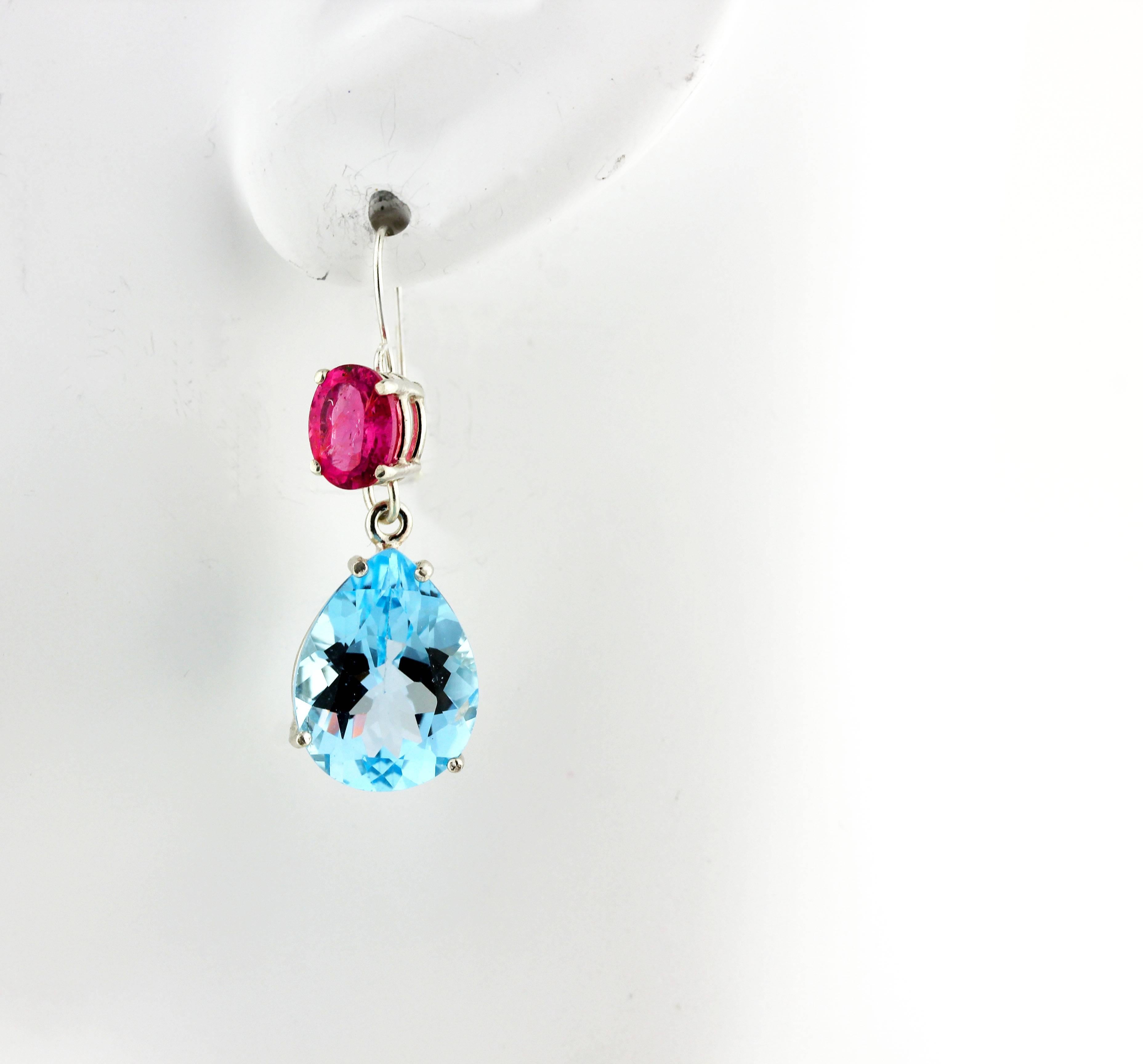 18.65 carats of brilliant swinging blue Topaz dangle wonderfully from these sparkling glittering 2.55 carats of pink Tourmalines set in sterling silver hook earrings.  The blue Topaz measure 15.8 mm x 11.92 mm and the pink Tourmaline measure 7.8 mm