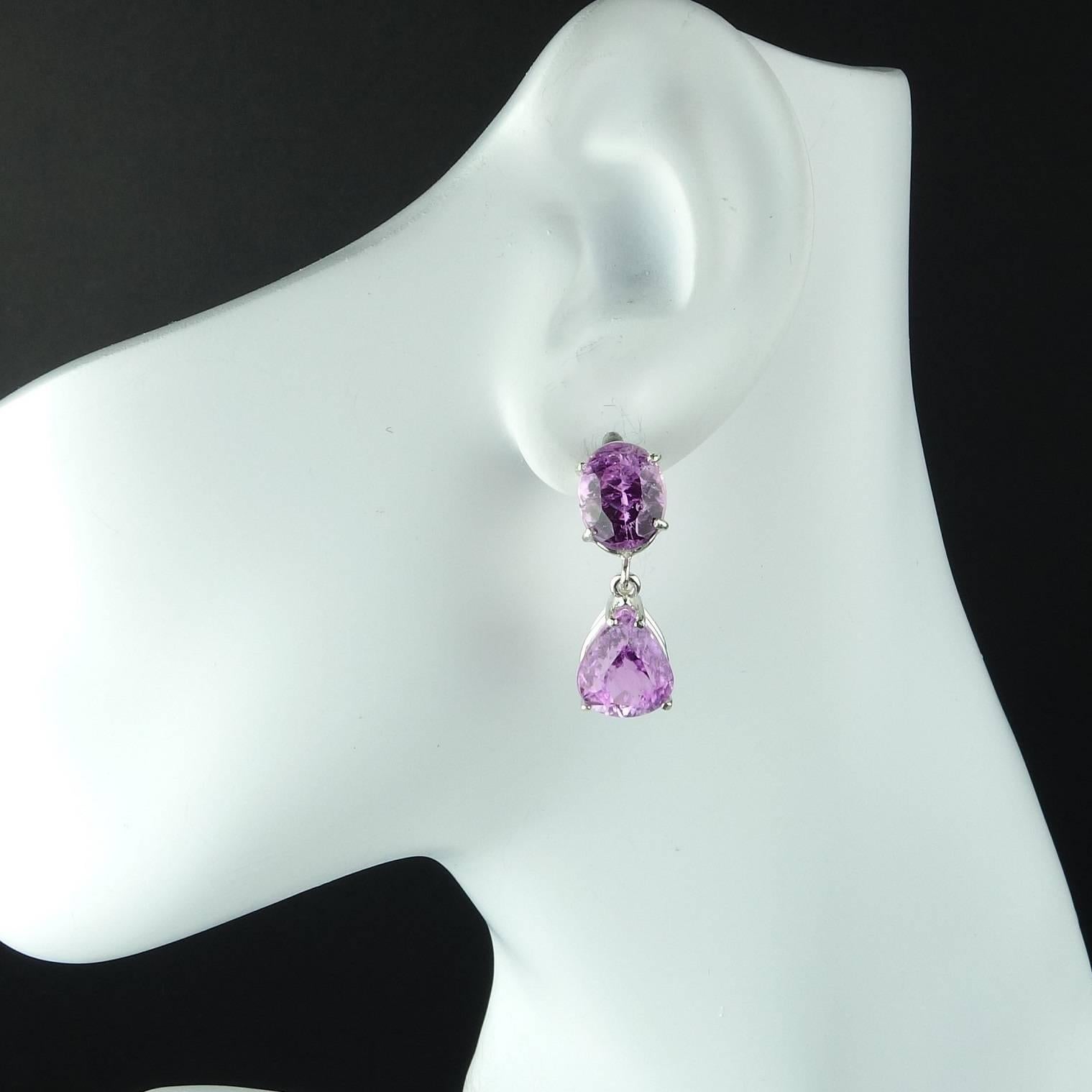 Brazilian Kunzite in oval and pear shapes creating stunning custom made earrings. These sparkling gemstones are set in Sterling Silver and feature post backs. The total weight of gemstones is approximately 21.26 carats. These unique beauties come