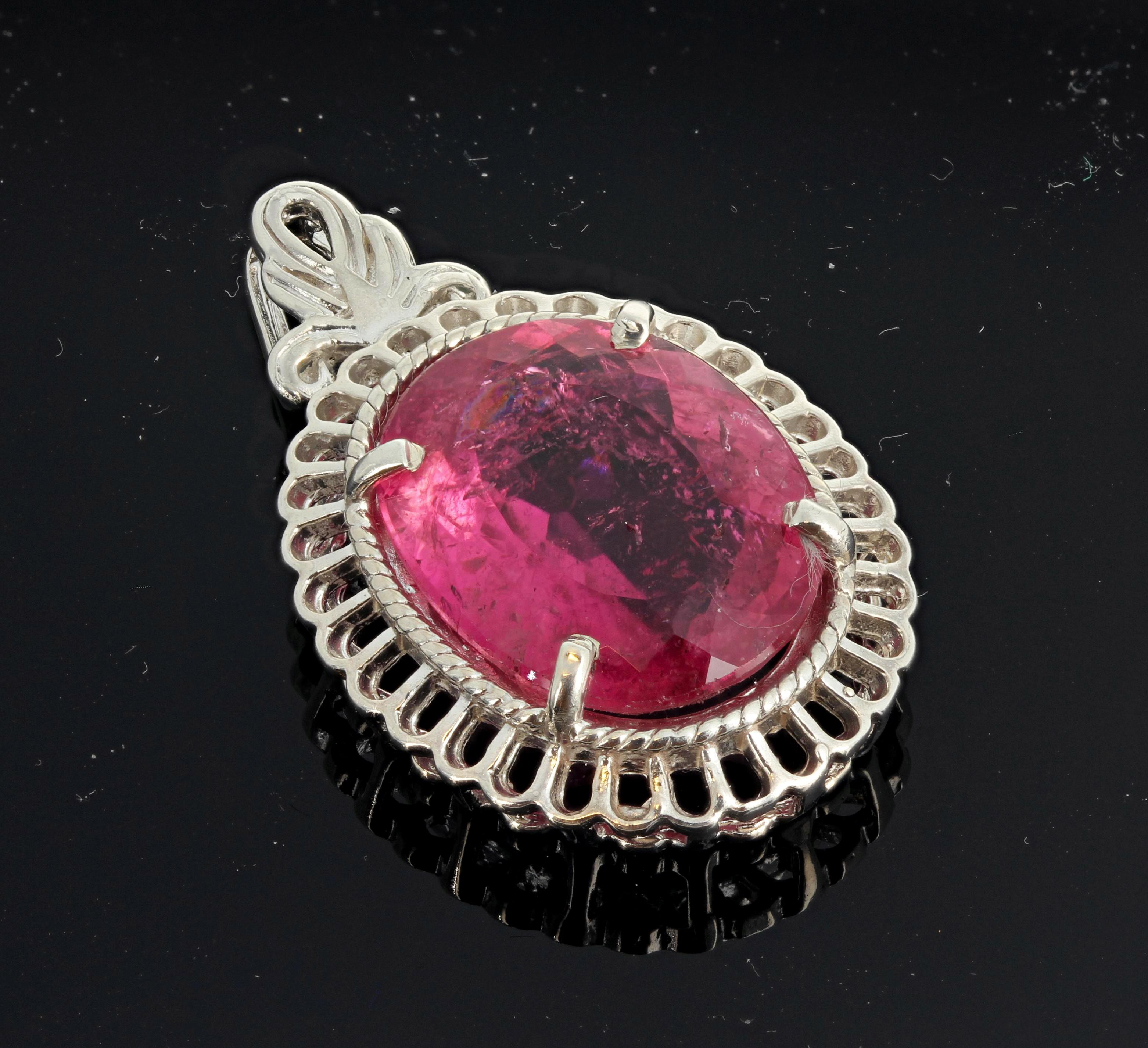 Brilliant glittering huge unusually large unique natural 15 carat pinky with reddish tones oval Tourmaline (18.2 mm x 14.4 mm) set in a sterling silver pendant.  This is approximately 1.35 inches long and came from the famous tourmaline mine in