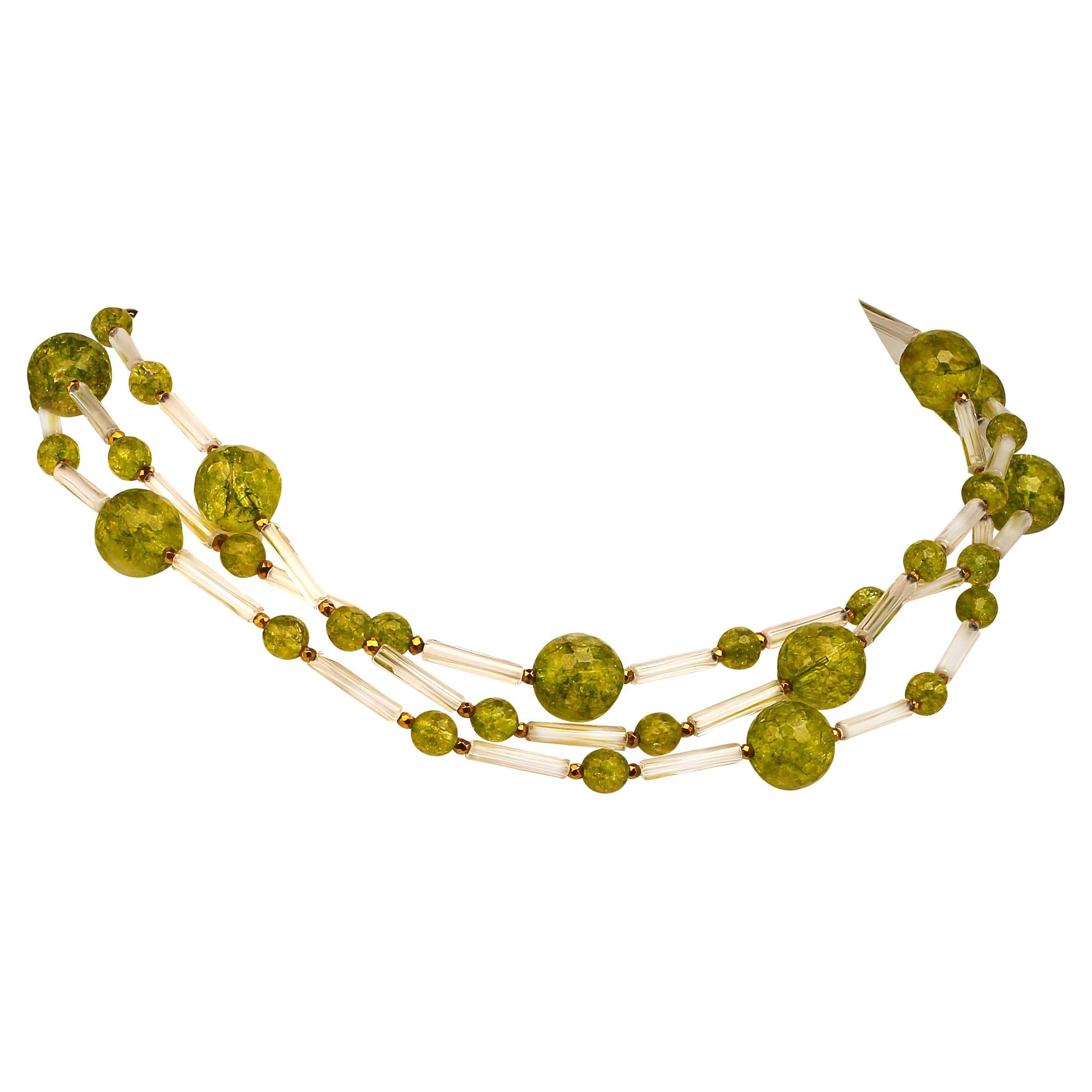 Unique, handmade necklace of Peridot and Crystal tubes.  The faceted Peridot are 12MM and 6MM accented with faceted pyrite and spaced with fine 15MM Crystal tubes which allow the Peridot to be the focal point of the necklace.  This three stand
