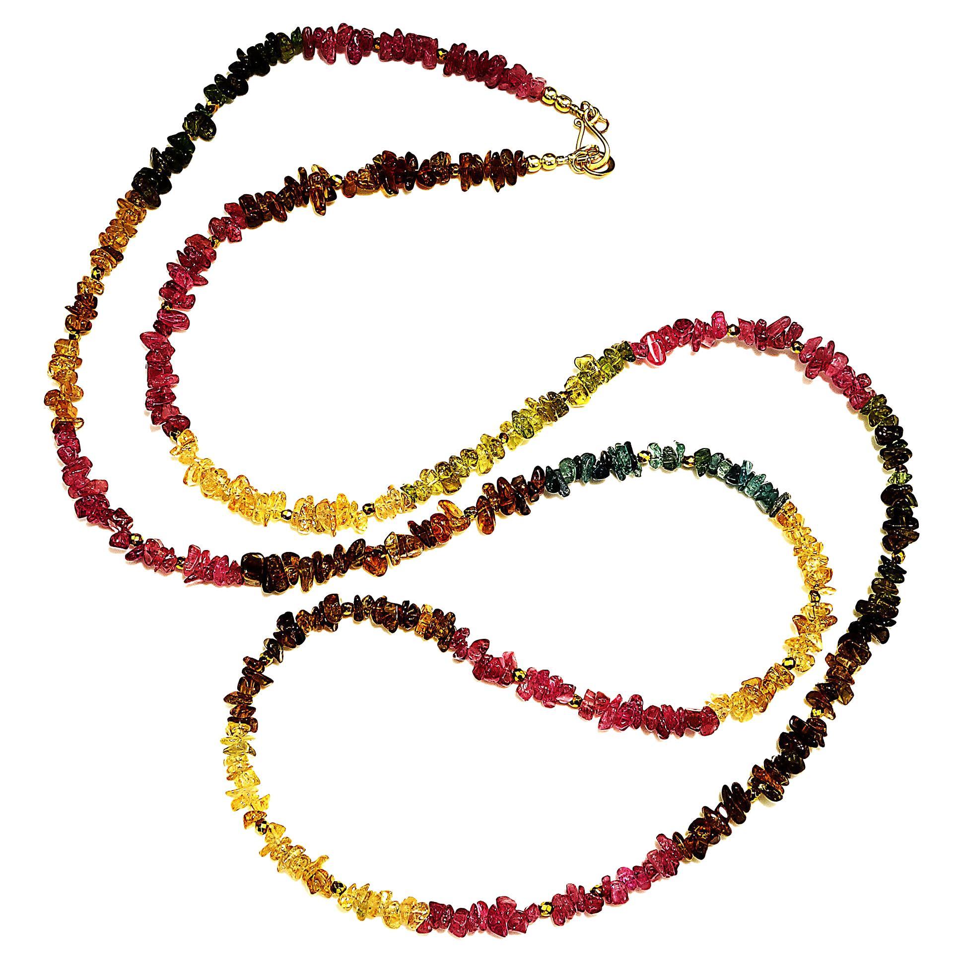 34 Inches of Brazilian Gemstone Polished Chips accented with faceted Pyrite necklace.  This gorgeous long drapey  necklace is an awesome display of color:  Pink, blue, brown, green, and gold.  It can be worn long, tied, looped around your neck