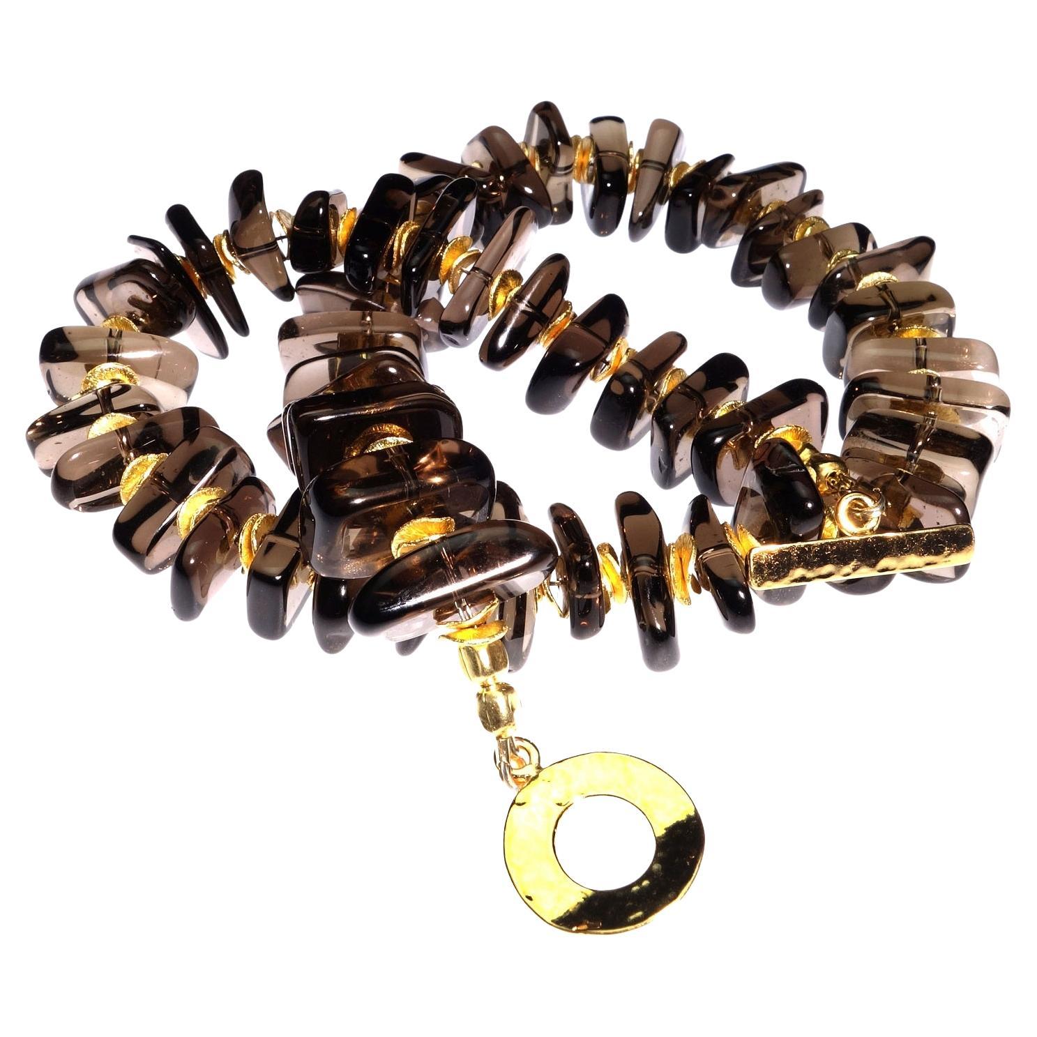 Custom made choker necklace of highly polished free form Smoky Quartz with gold tone accents.  This unique 16 inch choker necklace is a pleasure to wear.  The glowing Smoky Quartz are accented with our favorite gold tone flutters and a gold vermeil