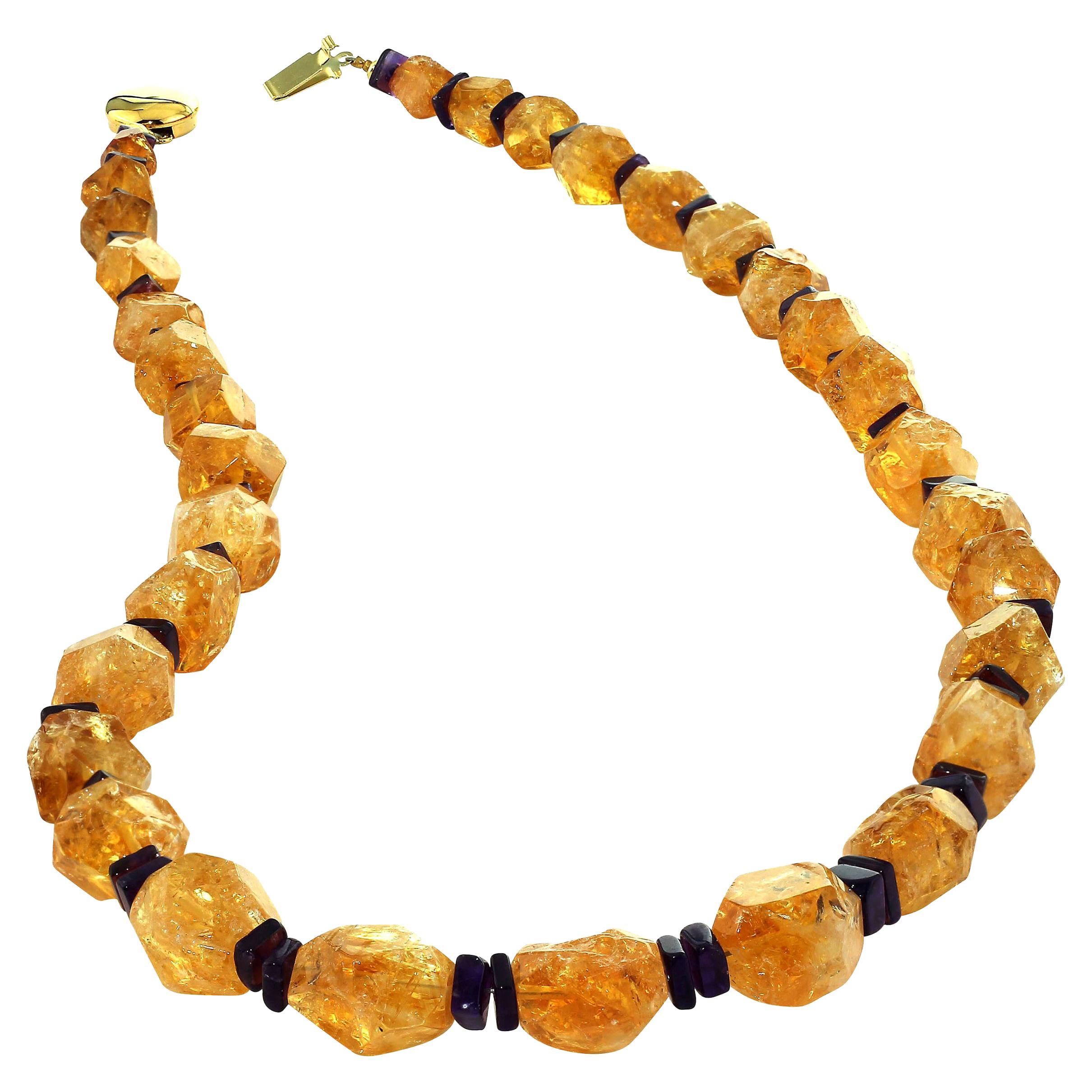 Handmade necklace of rich, golden Citrine roughly faceted and highly polished are accented with square slices of purple Amethyst. These Citrines are graduated up to 15 MM. This unique necklace is 21 inches in length. It is a lovely golden color